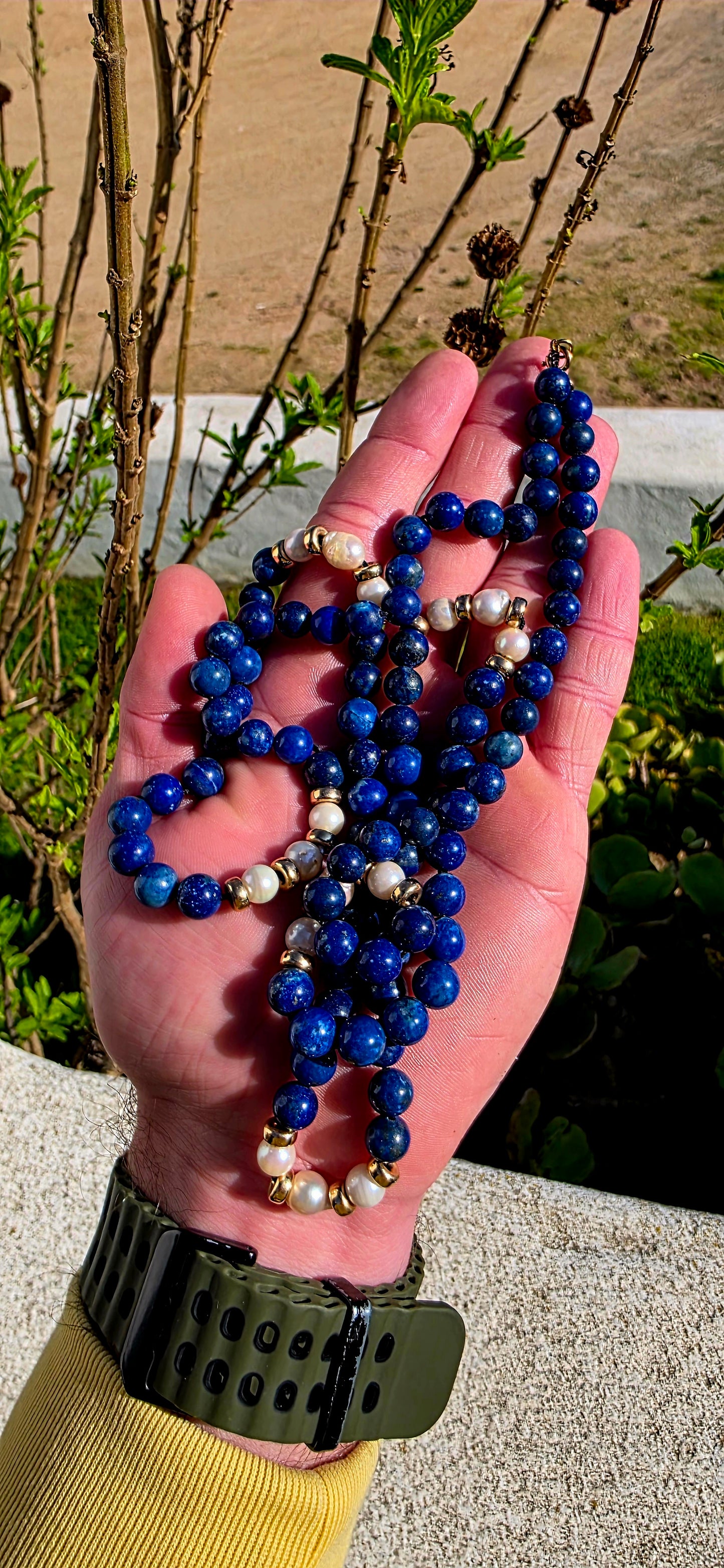 A striking statement piece that combines the rich blues of ancient royalty with the  elegance of pearls and gold.