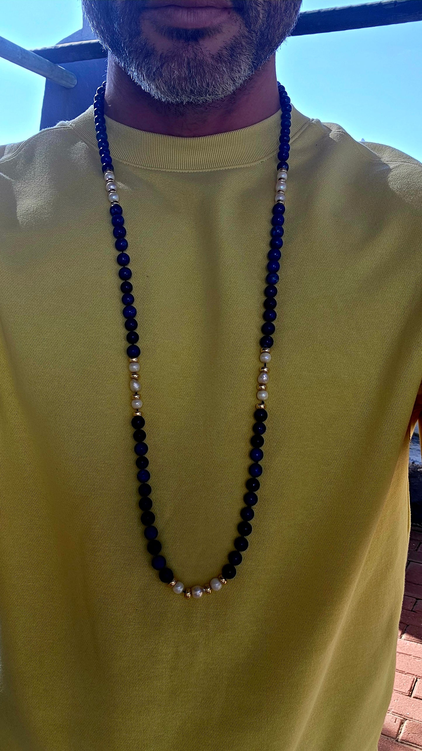 A striking statement piece that combines the rich blues of ancient royalty with the  elegance of pearls and gold.