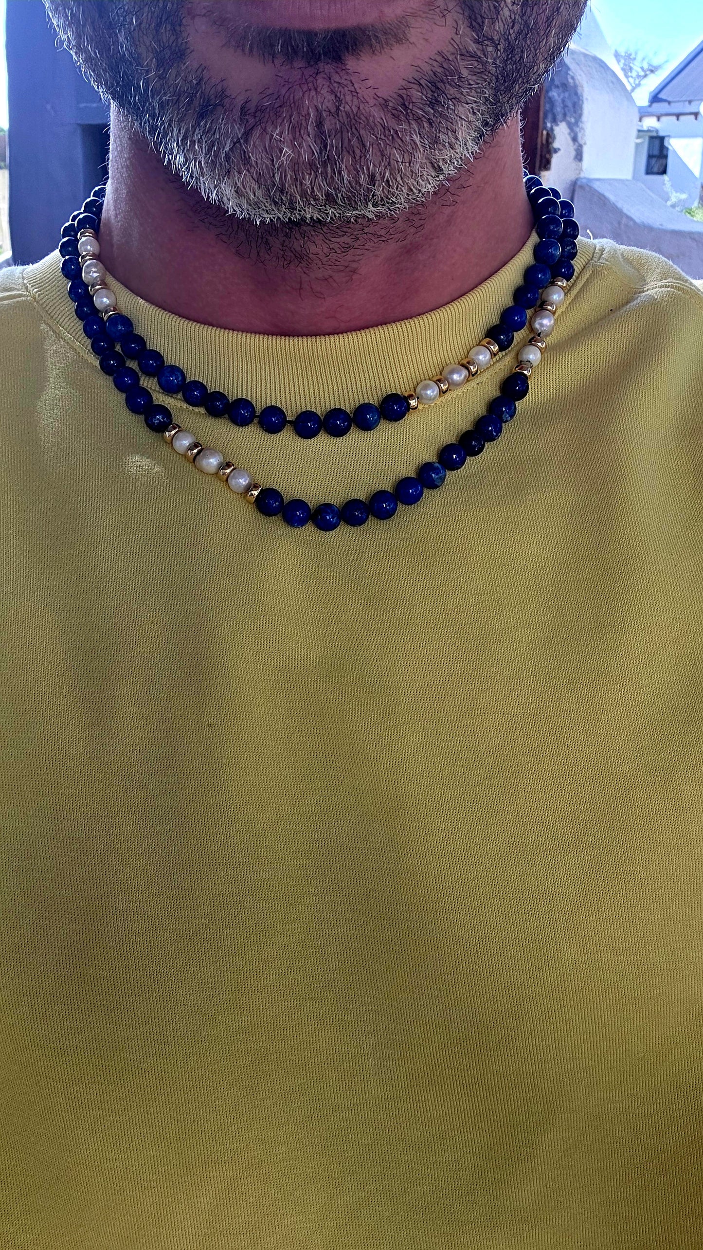 A striking statement piece that combines the rich blues of ancient royalty with the  elegance of pearls and gold.