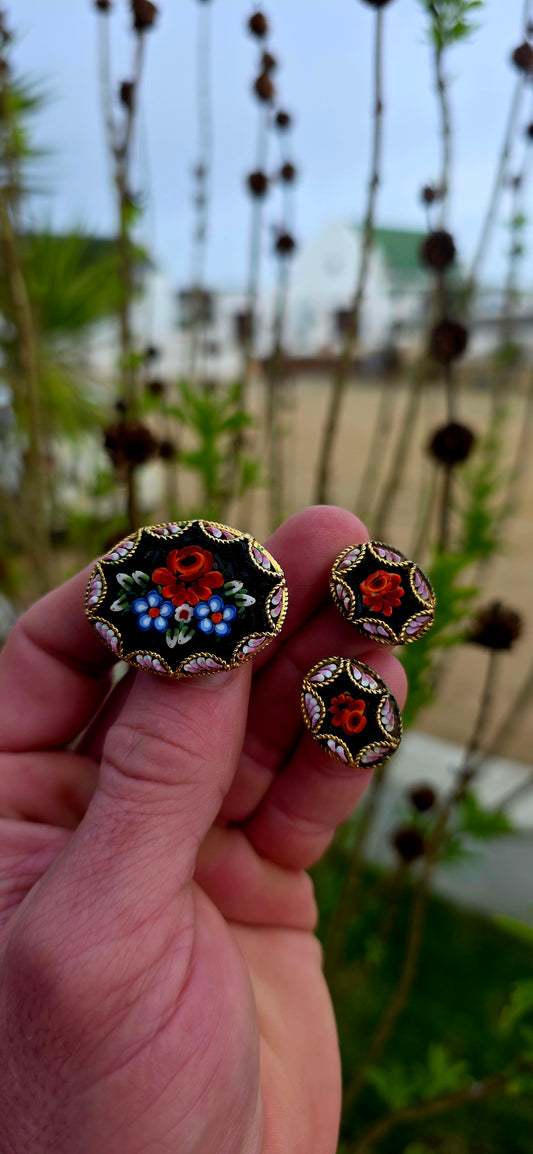 A wonderfully charming vintage jewellery suite dating to the 1970s, featuring a beautifully detailed micro mosaic brooch accompanied by its original matching clip-on earrings.