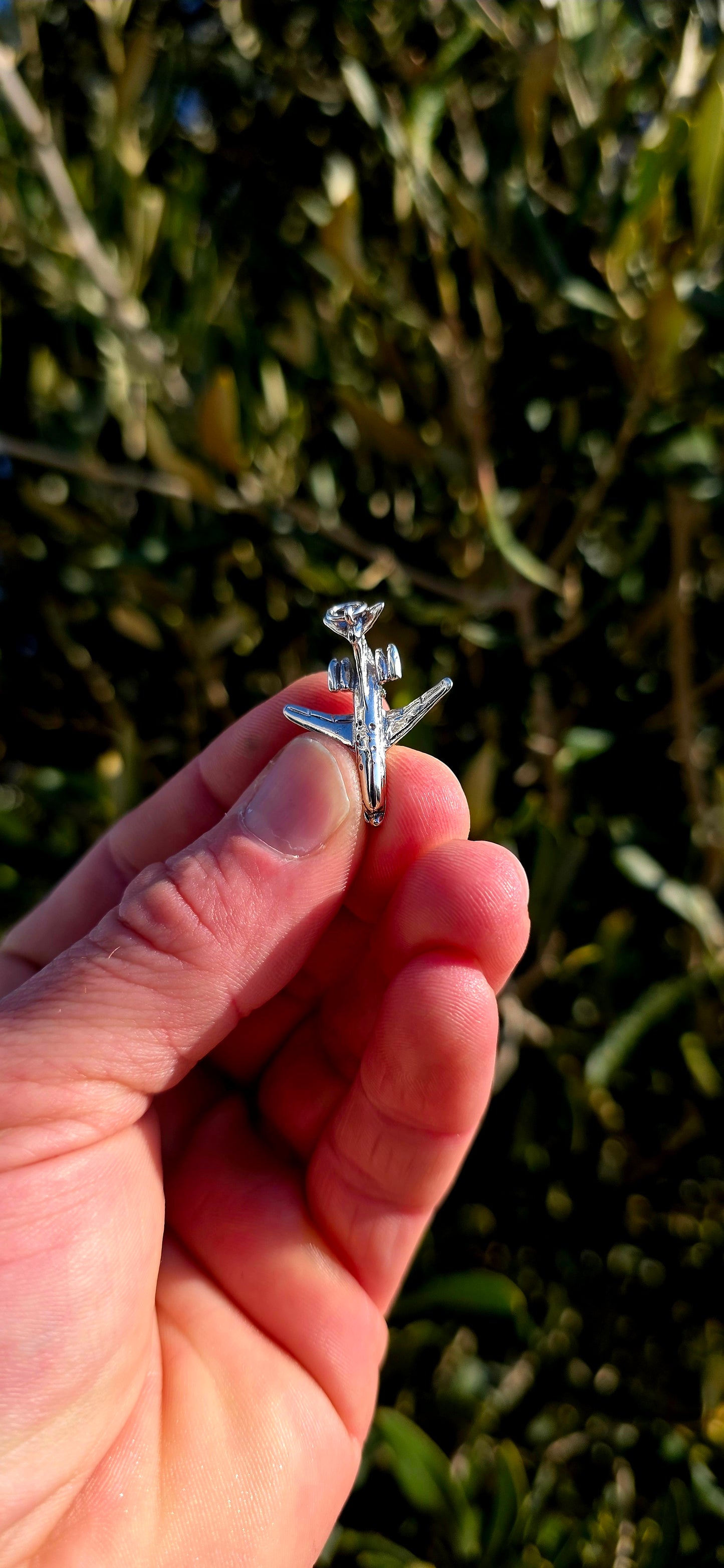 Up for grabs is a wonderfully detailed vintage sterling silver articulated charm in the shape of a miniature aeroplane.