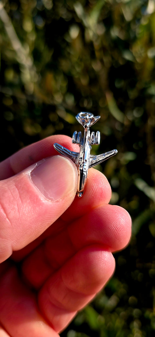 Up for grabs is a wonderfully detailed vintage sterling silver articulated charm in the shape of a miniature aeroplane.