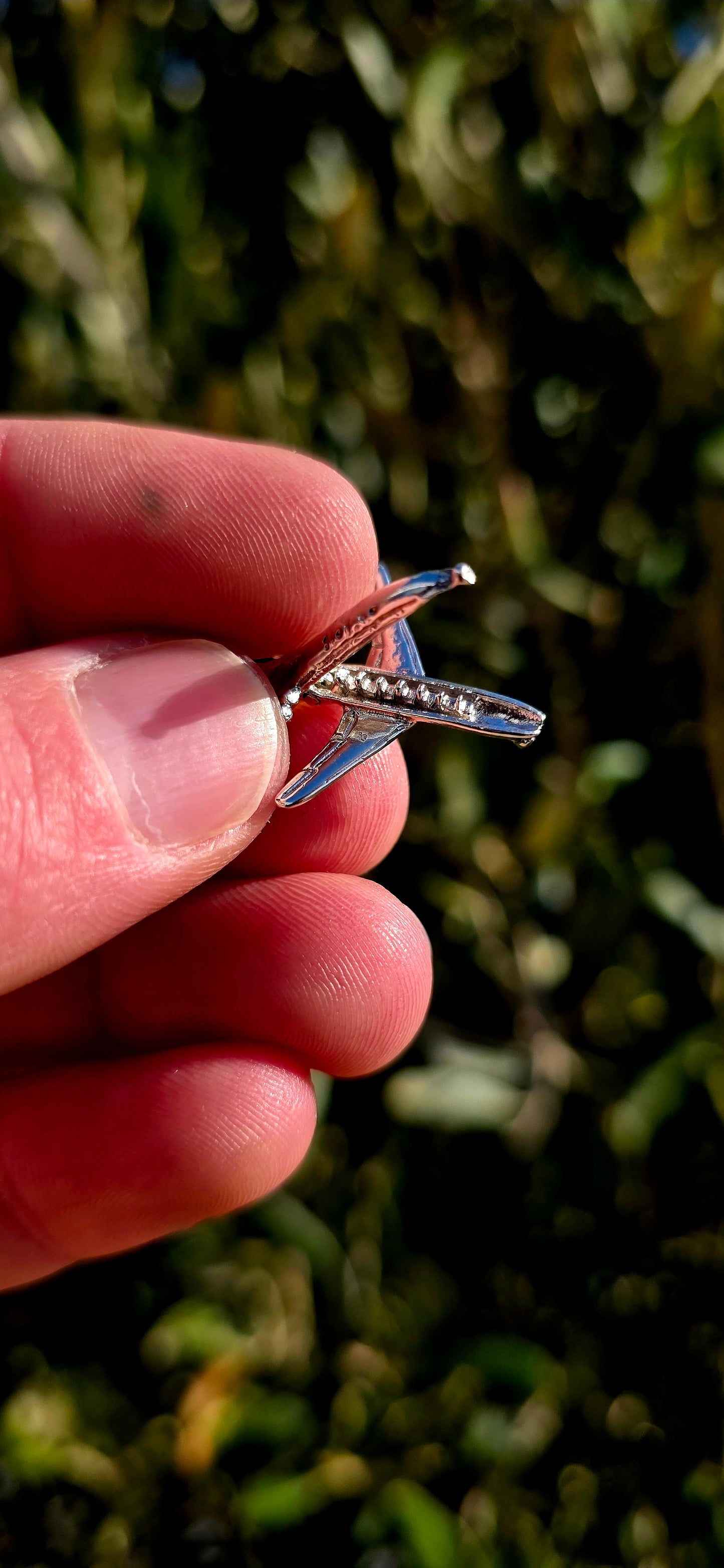 Up for grabs is a wonderfully detailed vintage sterling silver articulated charm in the shape of a miniature aeroplane.