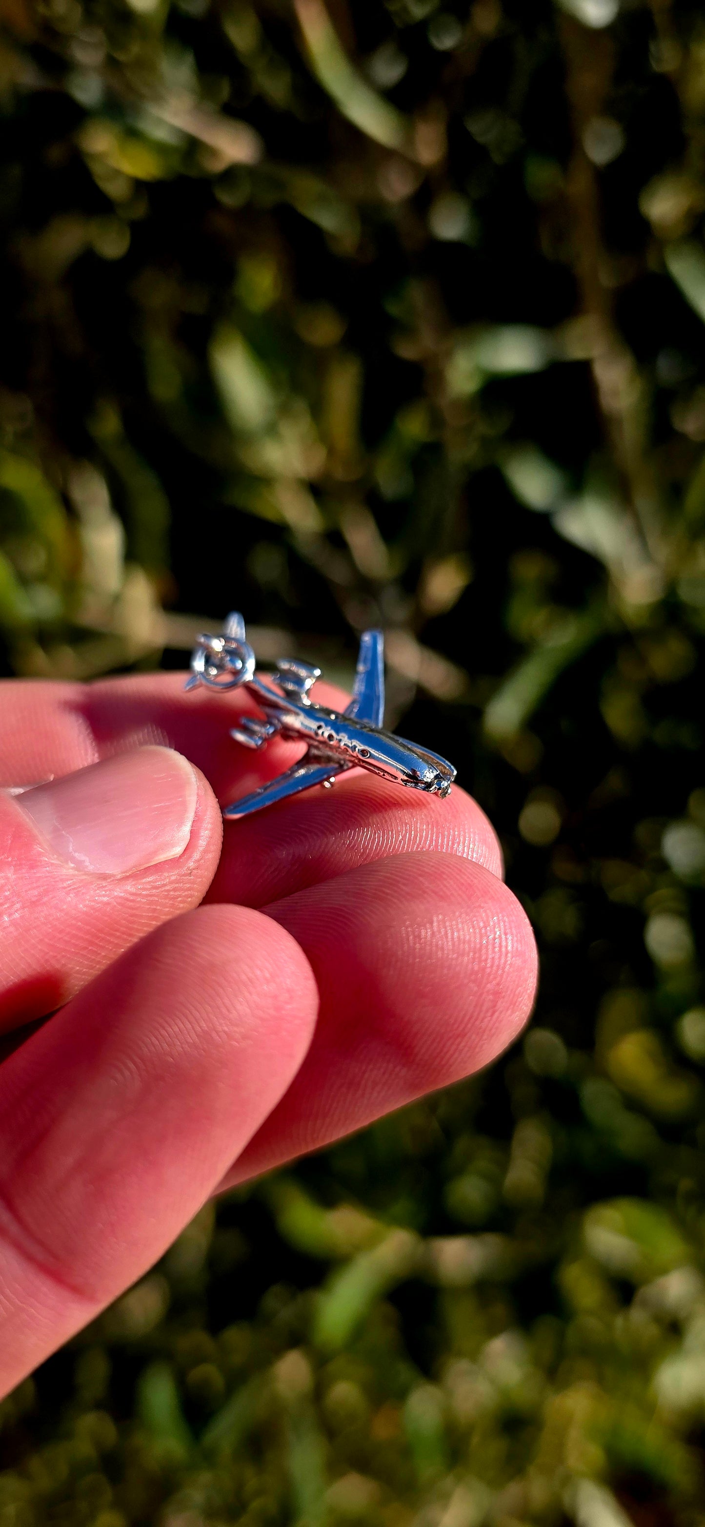 Up for grabs is a wonderfully detailed vintage sterling silver articulated charm in the shape of a miniature aeroplane.