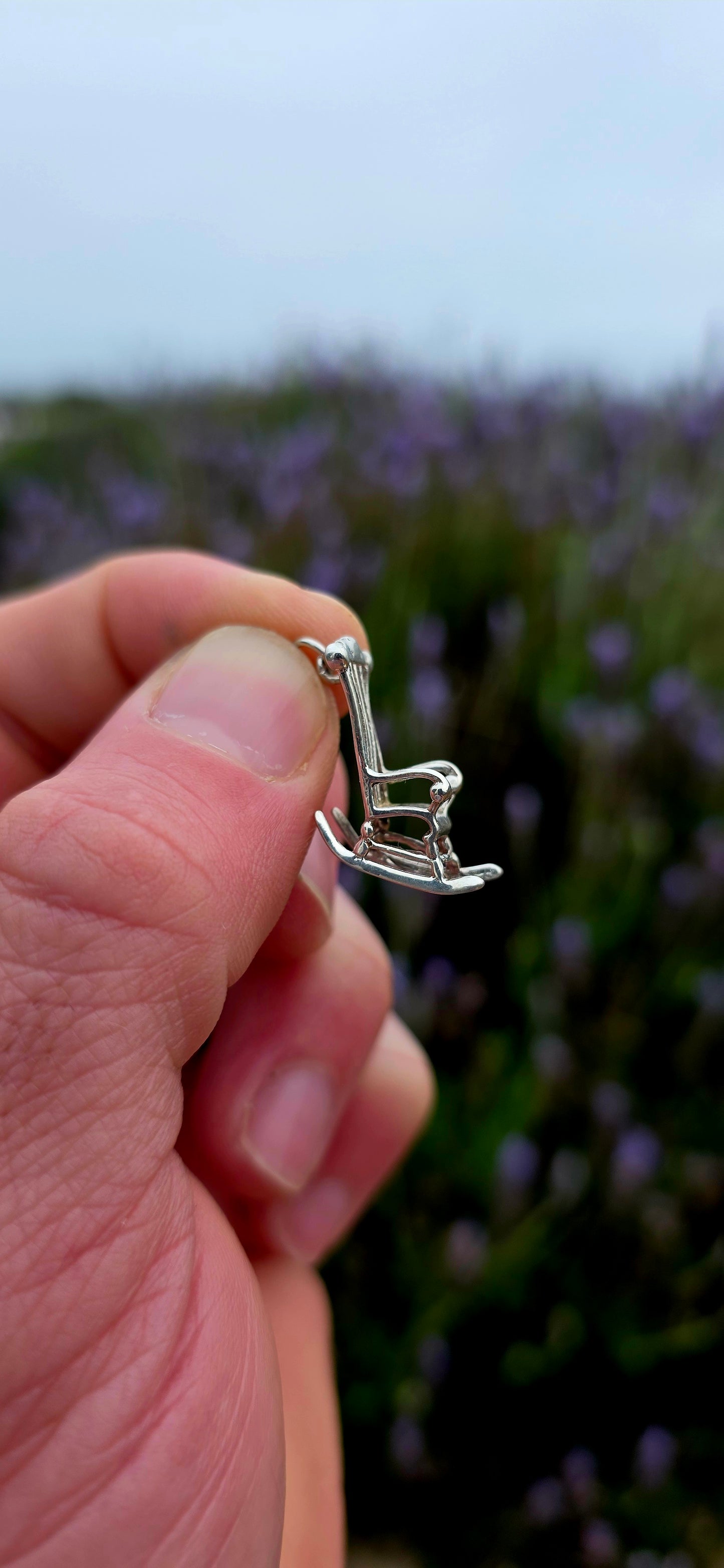 A wonderfully detailed and generously sized vintage sterling silver charm crafted in the shape of a traditional rocking chair.
