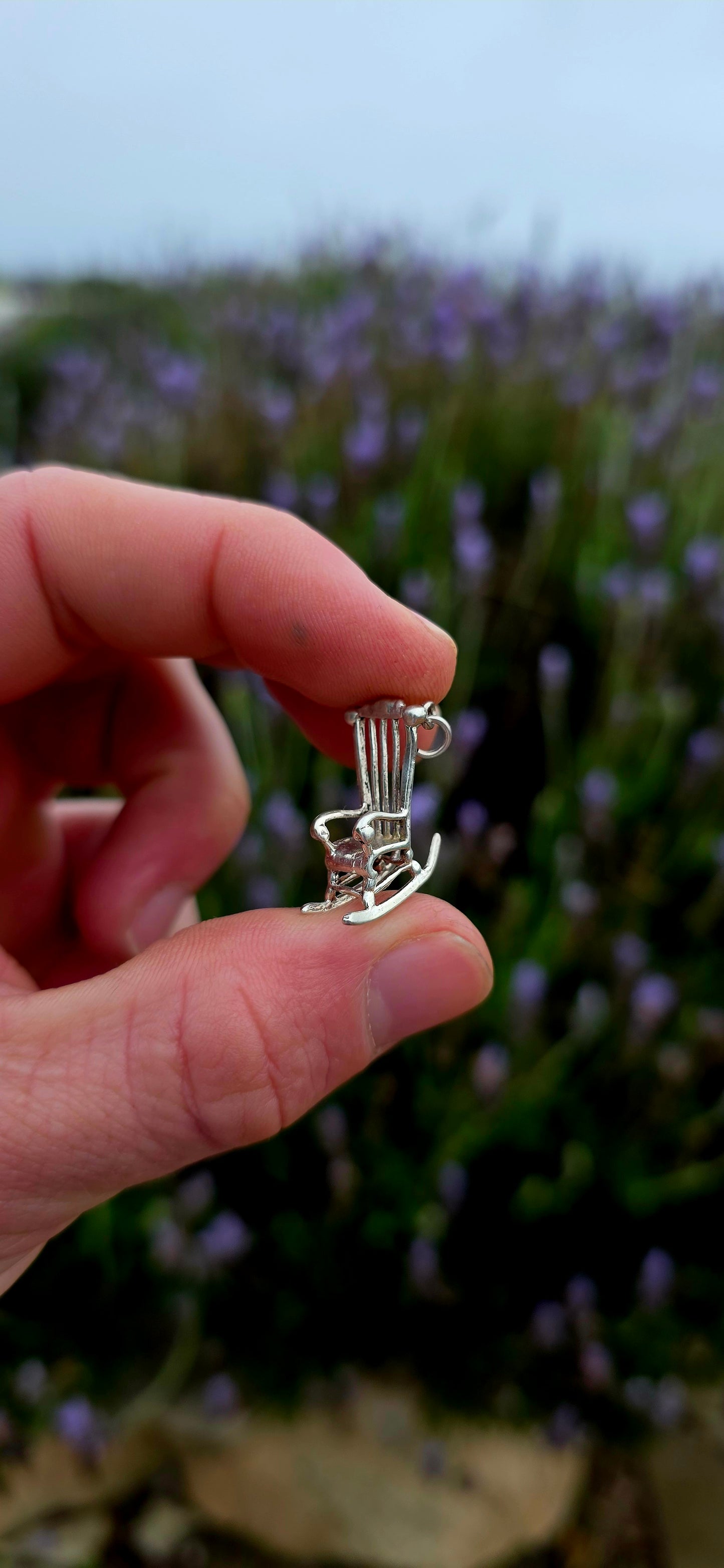 A wonderfully detailed and generously sized vintage sterling silver charm crafted in the shape of a traditional rocking chair.