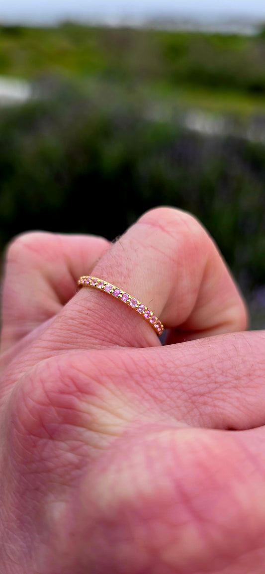 A fine and dainty full eternity stacking band, crafted in solid sterling silver and finished with a rich layer of 18ct yellow gold plating for that warm, timeless glow.