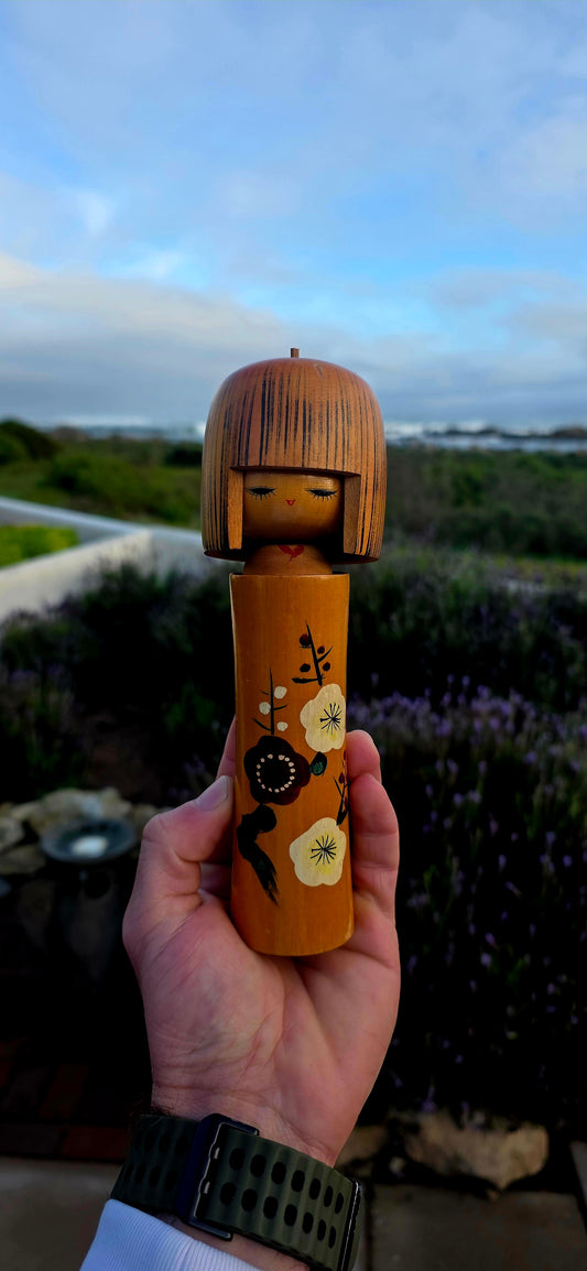 A wonderfully elegant and highly collectible vintage Japanese Kokeshi doll dating to the 1950s.