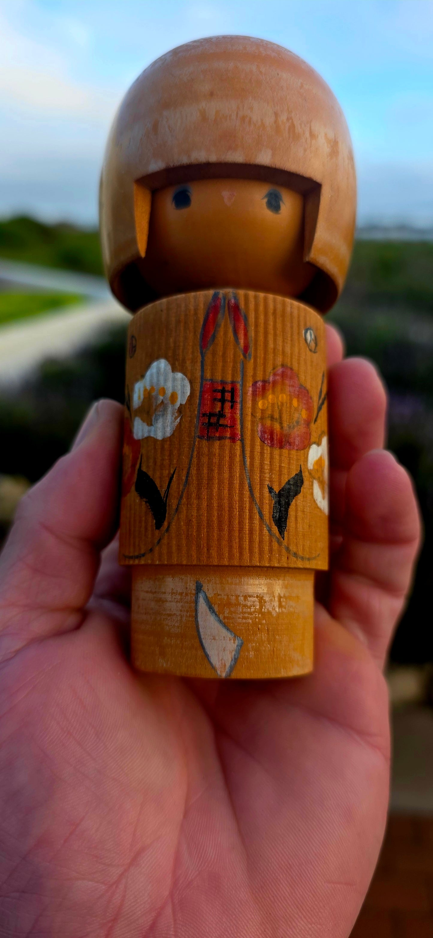A delightful and highly collectible vintage Japanese Kokeshi doll dating to the 1950s.
