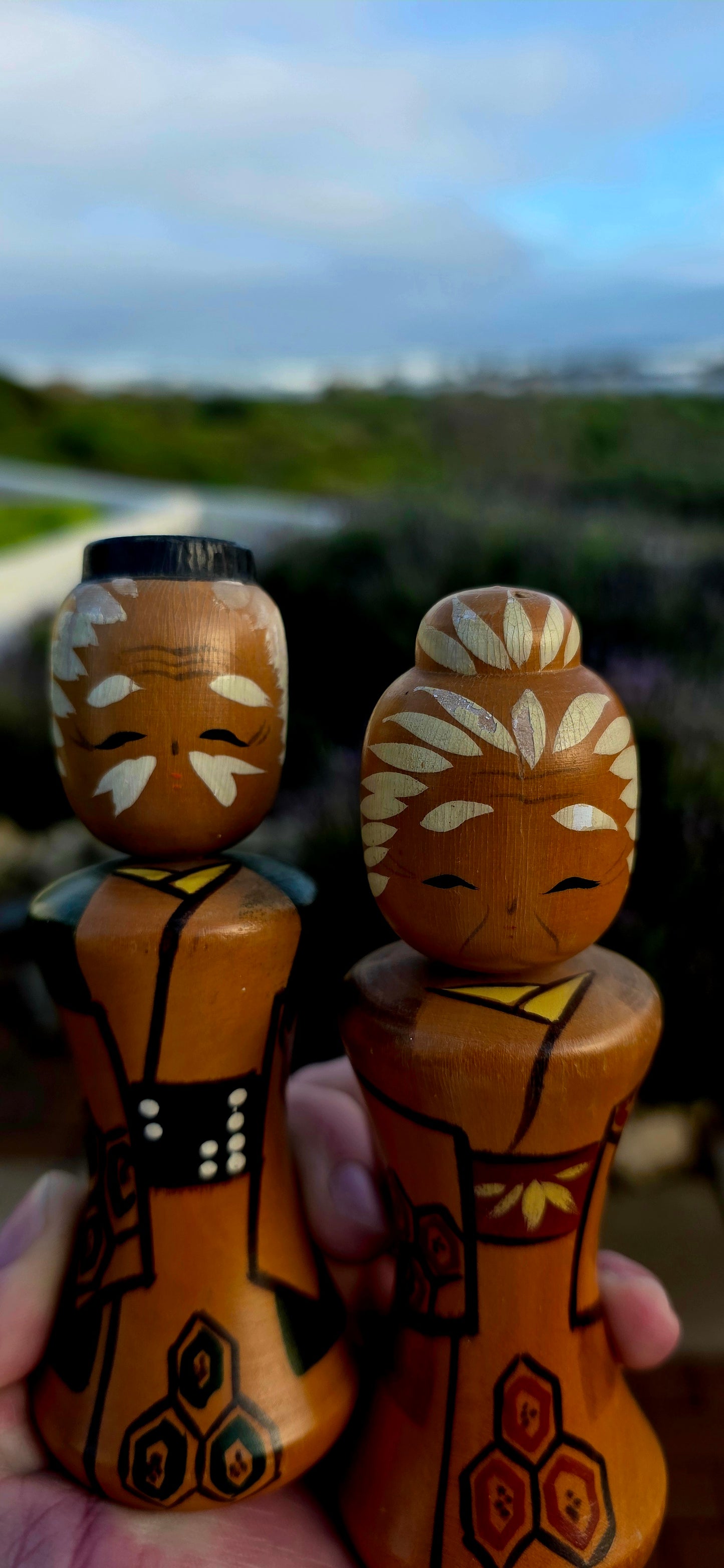 A wonderfully charming and highly collectible pair of vintage Japanese Kokeshi dolls dating to the 1950s .