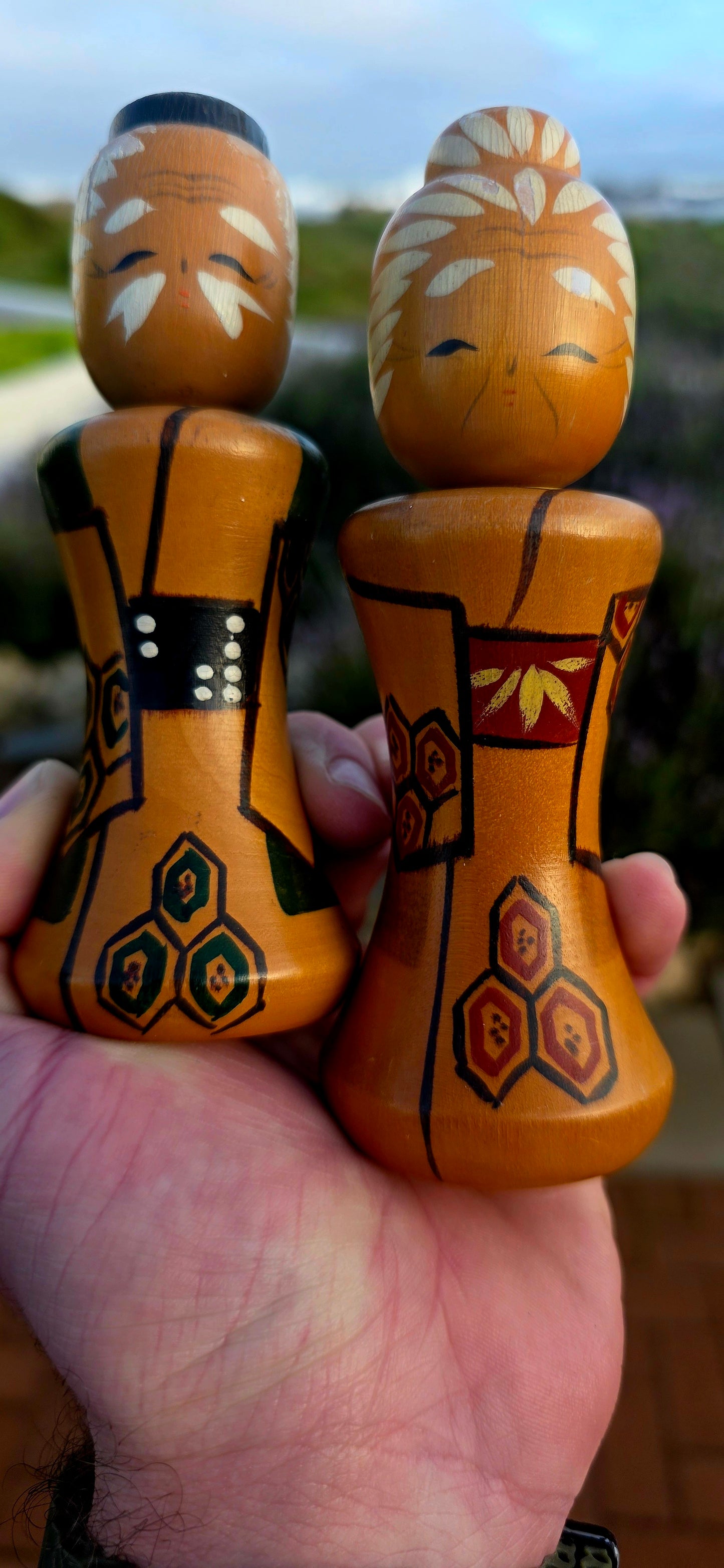 A wonderfully charming and highly collectible pair of vintage Japanese Kokeshi dolls dating to the 1950s .