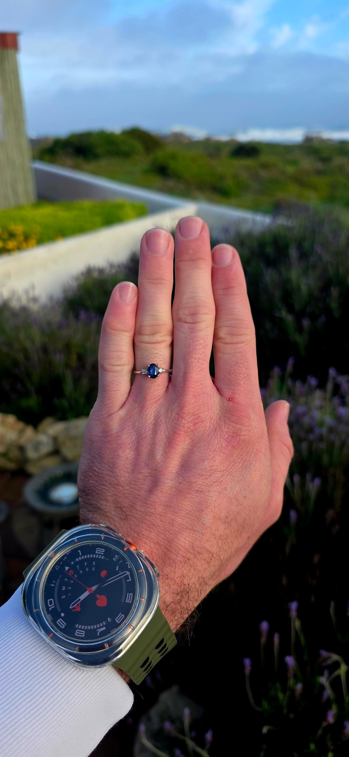 Crafted in sterling silver, this elegant trilogy ring features a captivating oval-cut natural kyanite gemstone at its centre, secured within a classic prong setting.