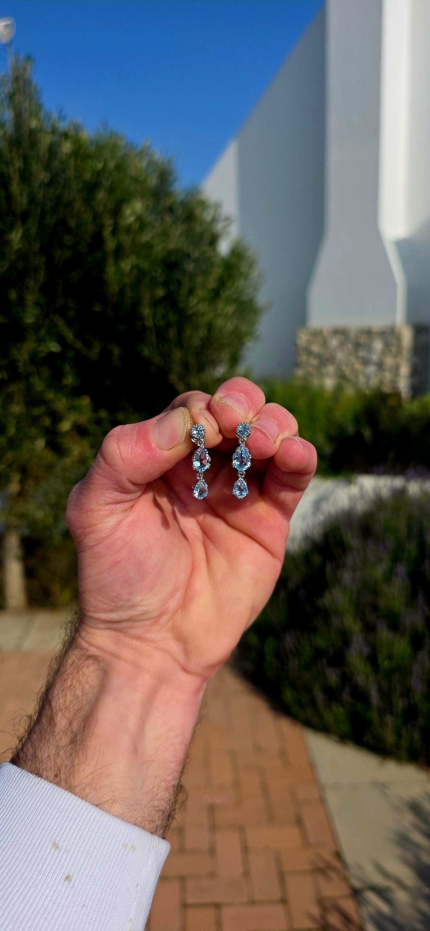 Elegant, graceful, and full of movement... these beautiful sterling silver drop earrings capture the crystal-clear beauty of a cloudless summer sky.
