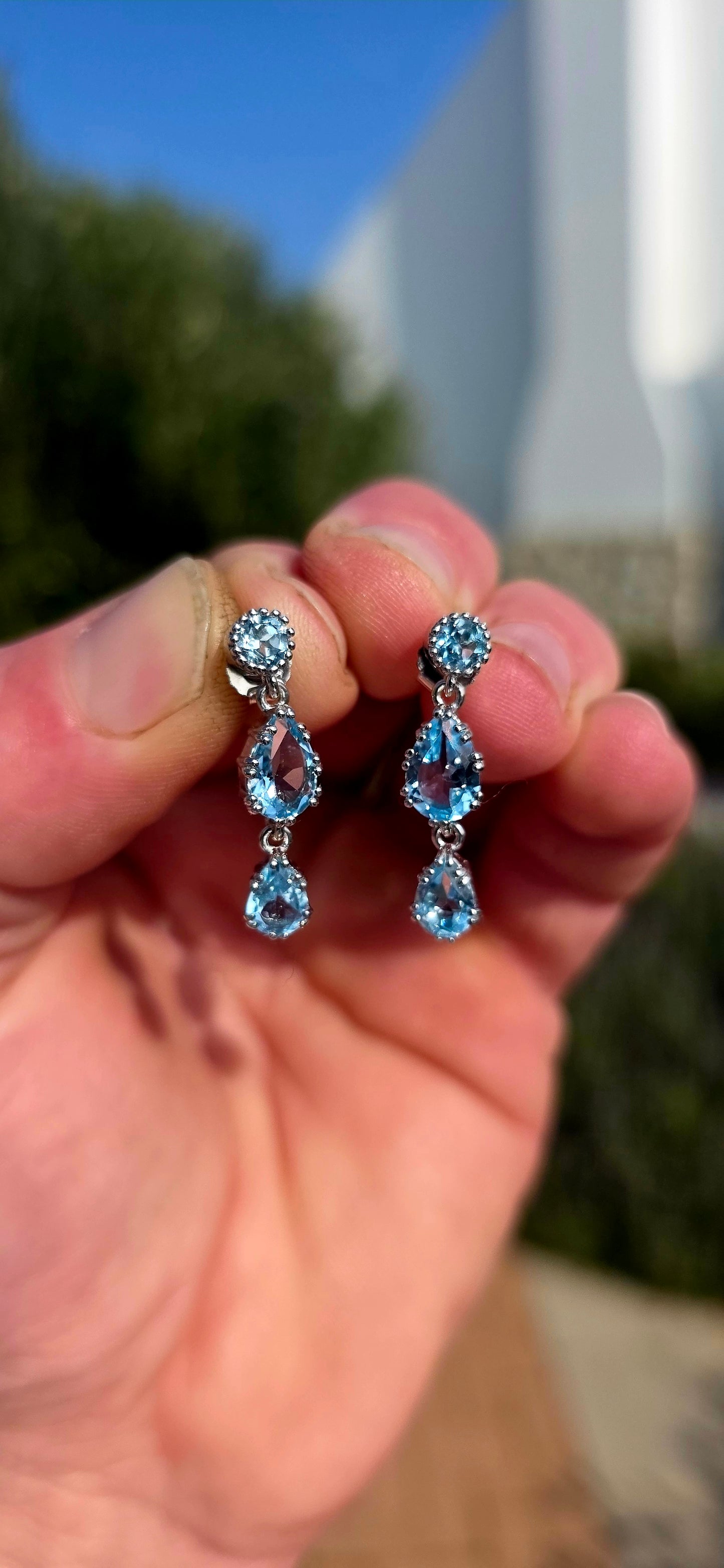 Elegant, graceful, and full of movement... these beautiful sterling silver drop earrings capture the crystal-clear beauty of a cloudless summer sky.