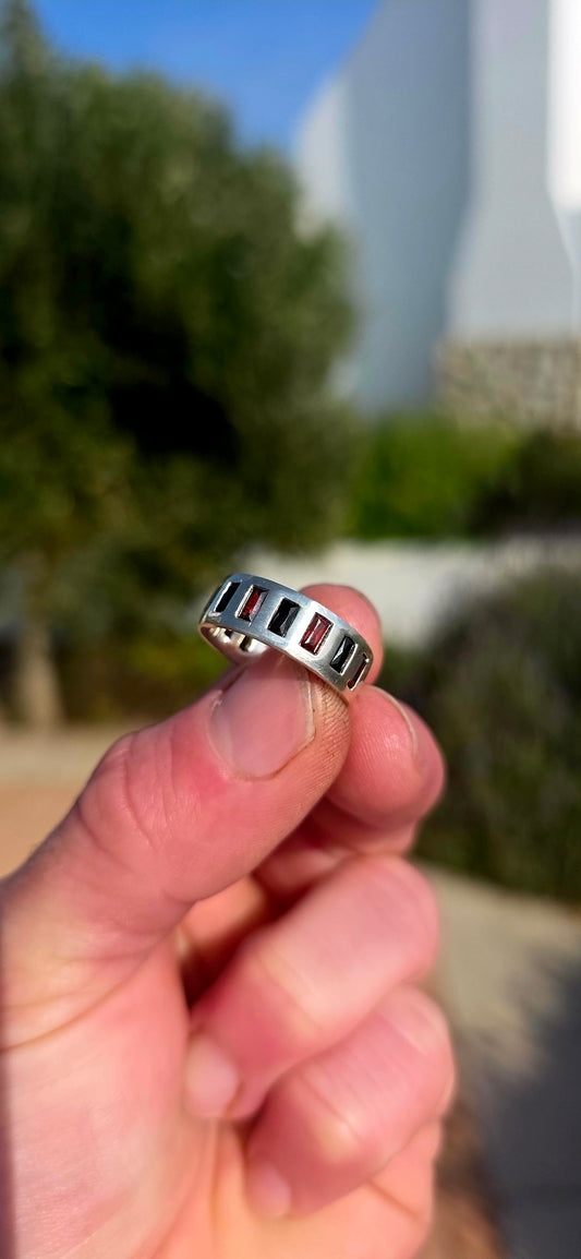 Darkly elegant with a contemporary edge... this striking sterling silver eternity-style band is a piece that blurs the line between classic and modern.