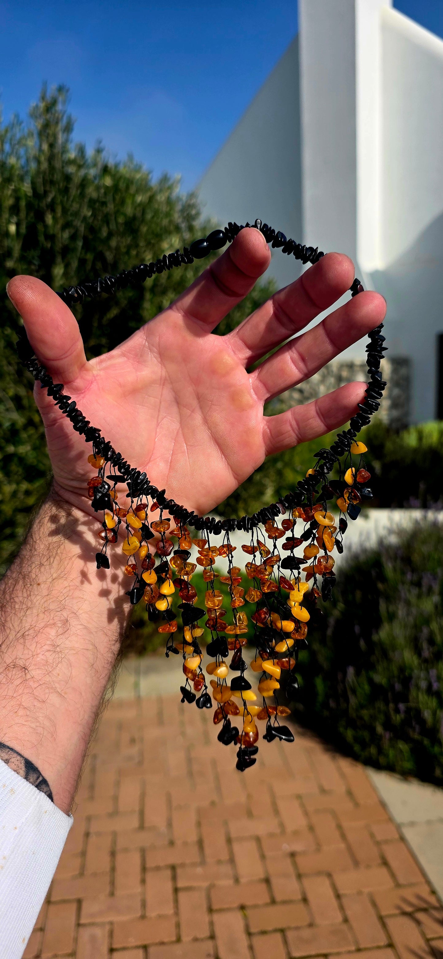 Handmade and gloriously bold, this chunky statement piece is crafted from natural Baltic amber chips.