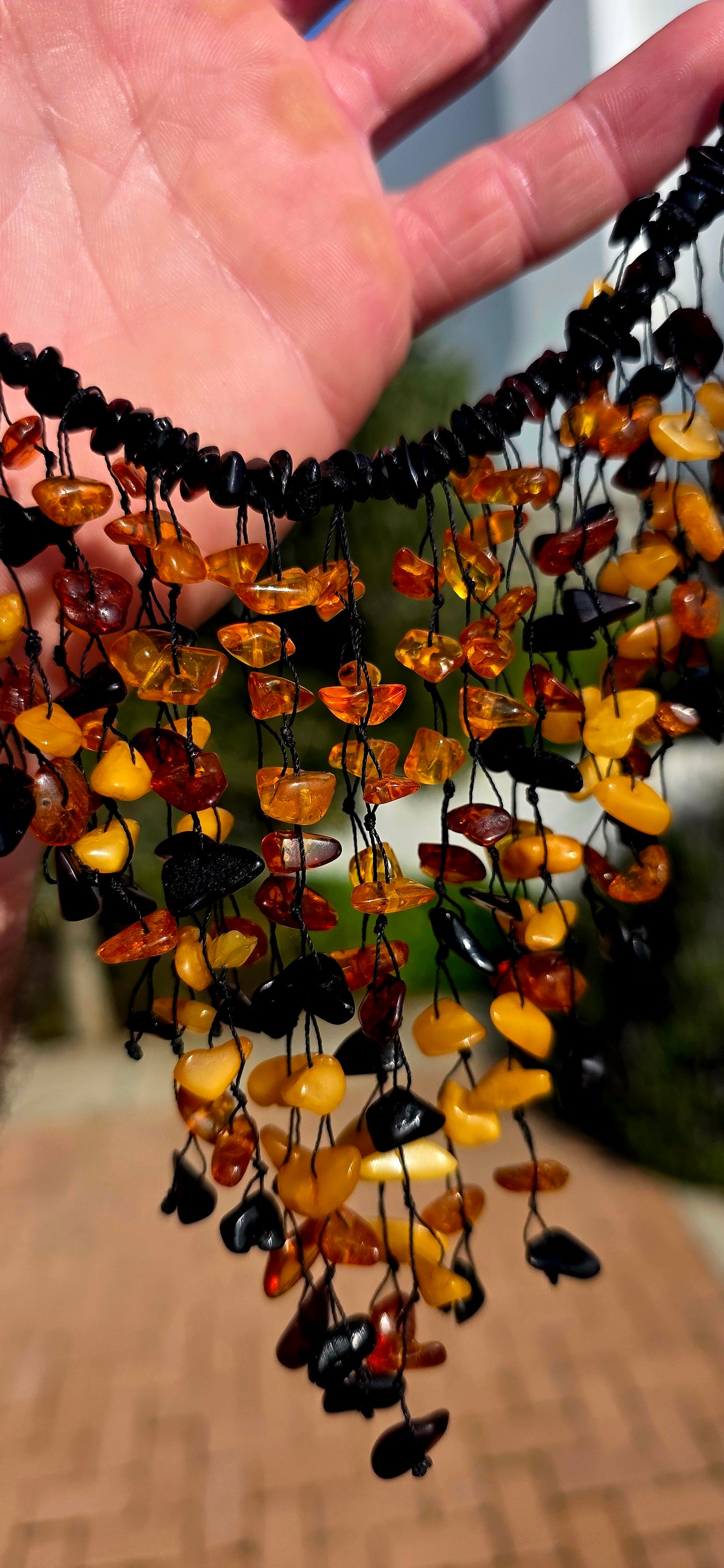 Handmade and gloriously bold, this chunky statement piece is crafted from natural Baltic amber chips.