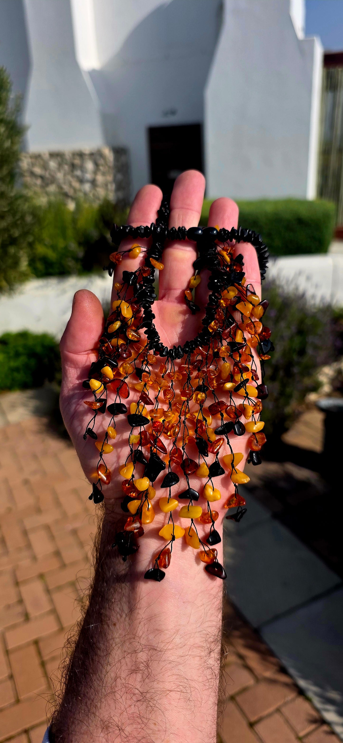Handmade and gloriously bold, this chunky statement piece is crafted from natural Baltic amber chips.