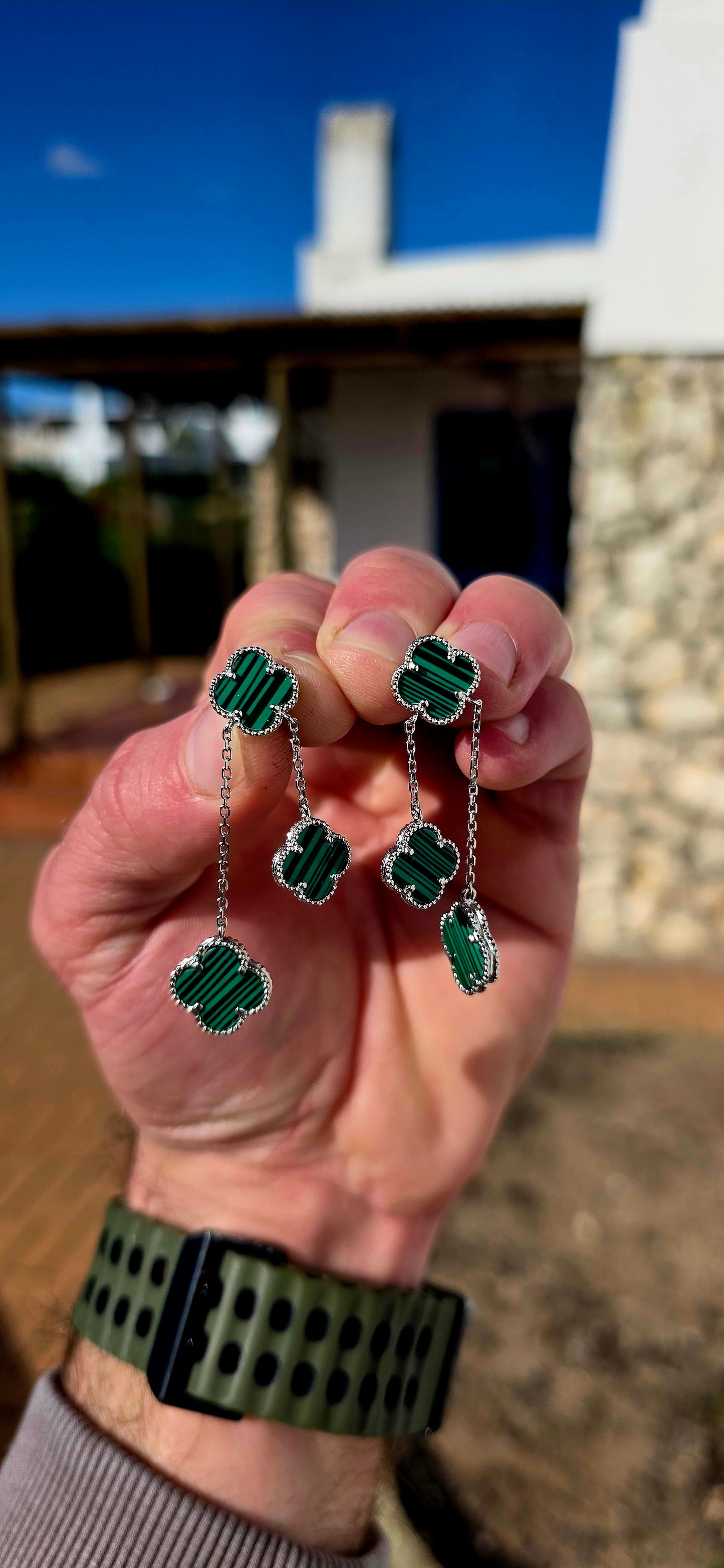 Crafted in sterling silver, each earring features three beautifully carved  malachite clovers, delicately framed with fine beaded silver borders that add a touch of vintage-inspired elegance.