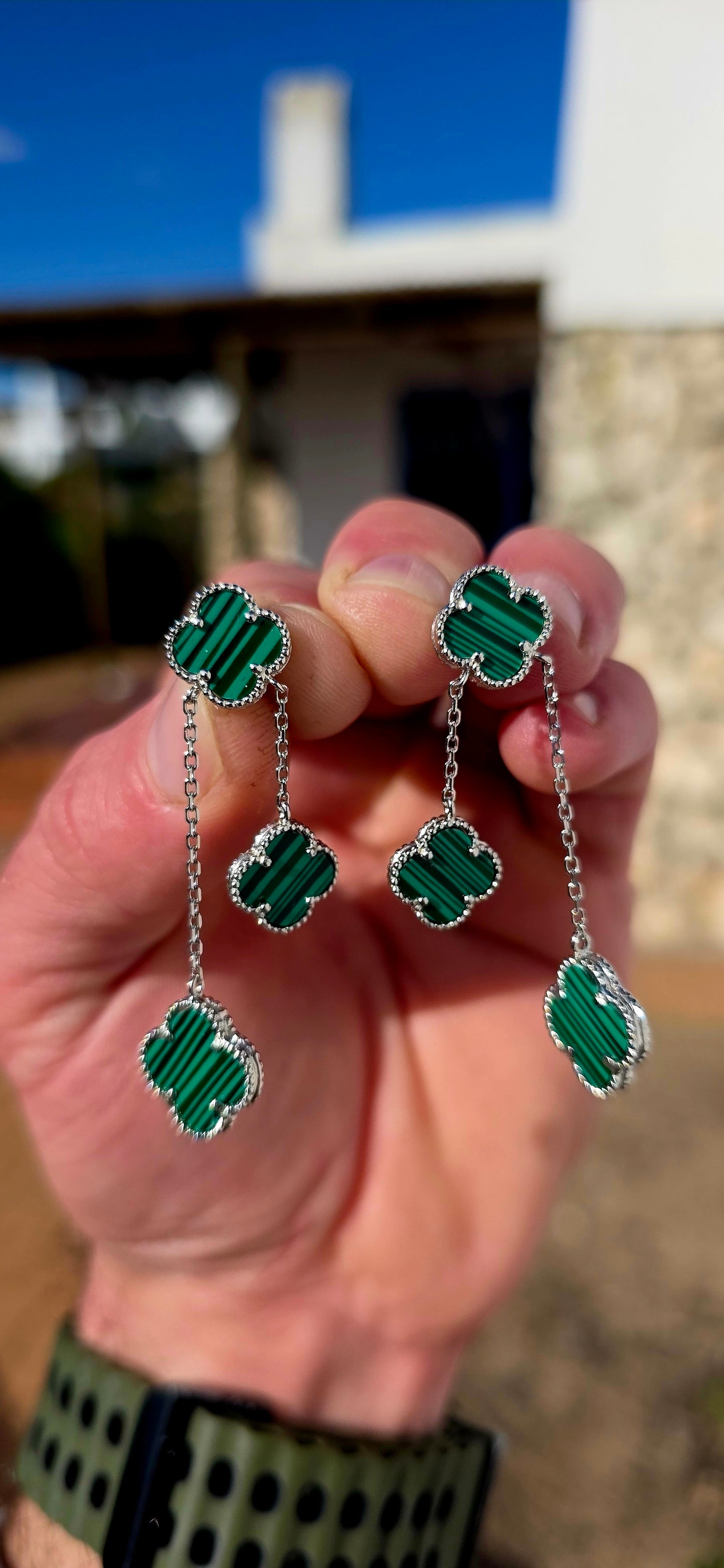 Crafted in sterling silver, each earring features three beautifully carved  malachite clovers, delicately framed with fine beaded silver borders that add a touch of vintage-inspired elegance.
