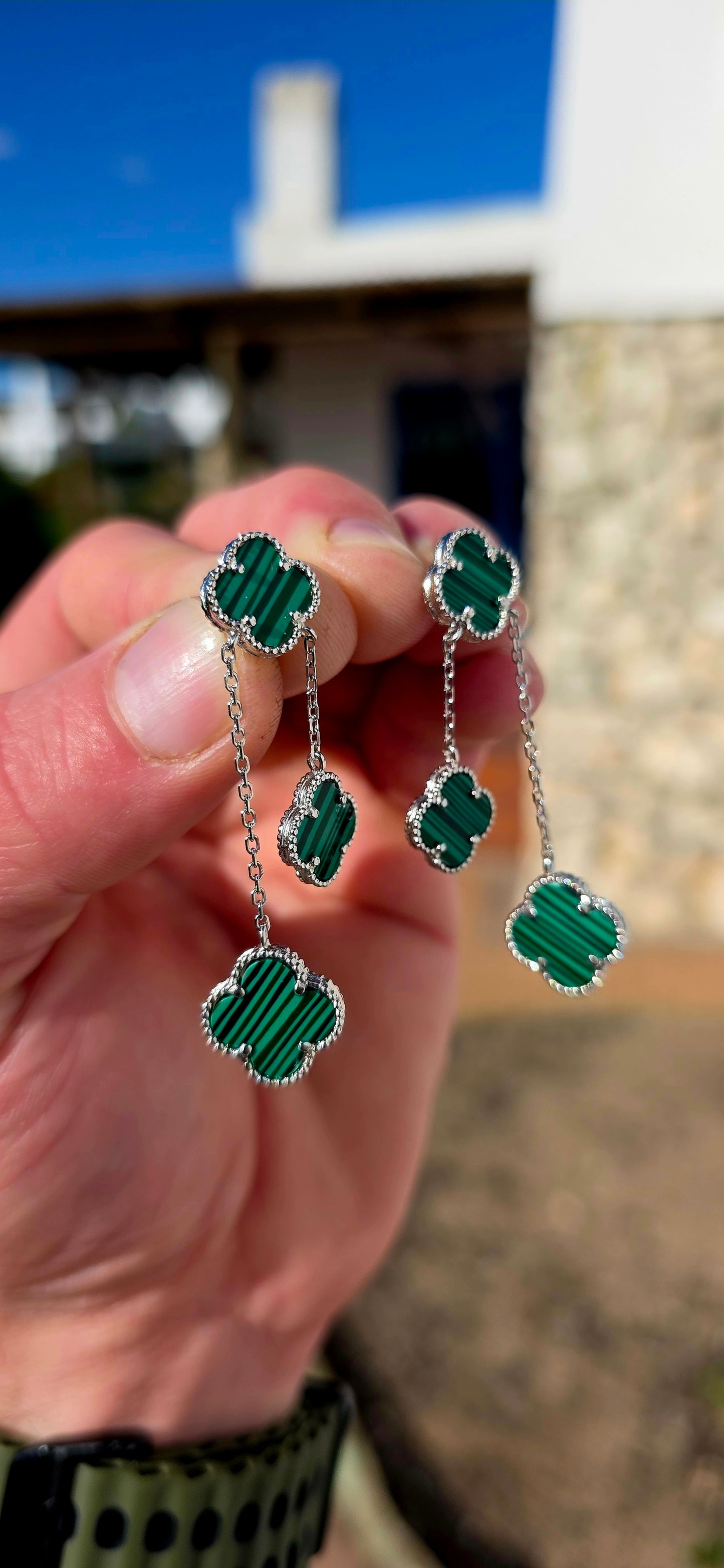 Crafted in sterling silver, each earring features three beautifully carved  malachite clovers, delicately framed with fine beaded silver borders that add a touch of vintage-inspired elegance.