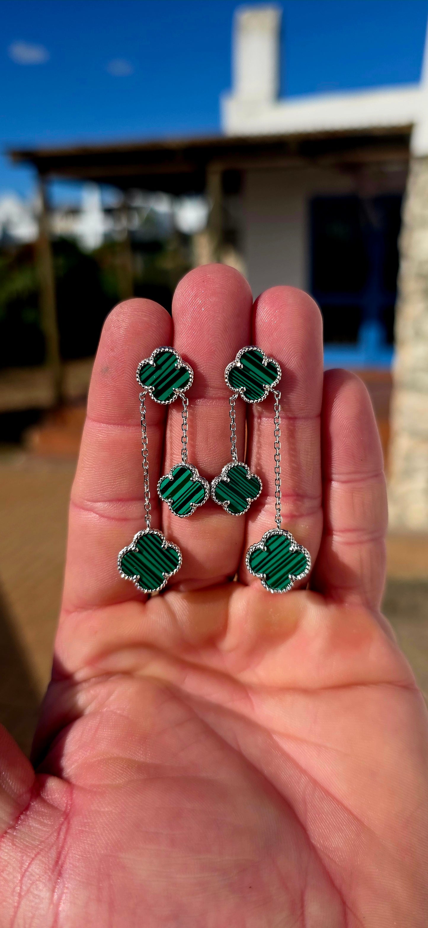 Crafted in sterling silver, each earring features three beautifully carved  malachite clovers, delicately framed with fine beaded silver borders that add a touch of vintage-inspired elegance.