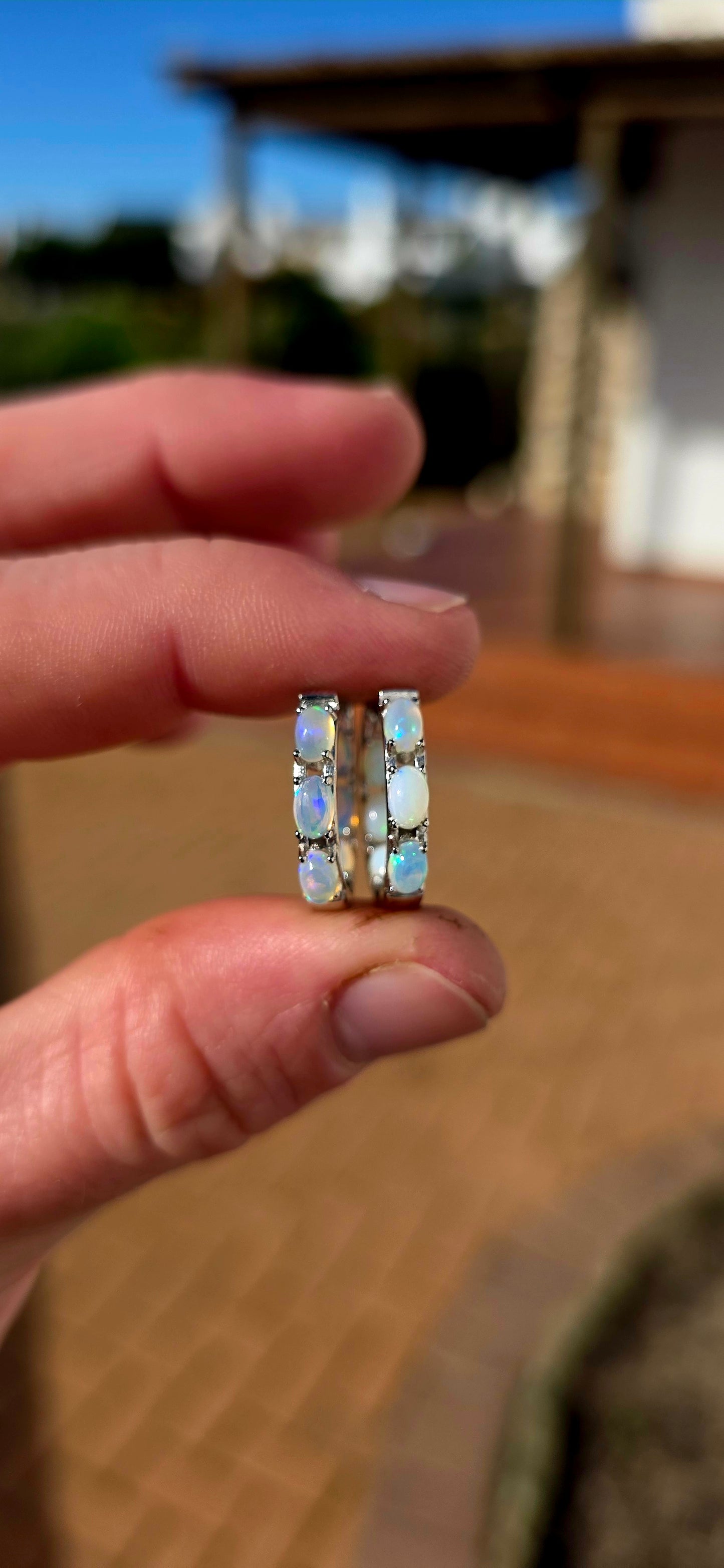 These sterling silver Ethiopian opal huggie earrings are pure magic... extremely elegant with a mesmerising display of colour that changes with every movement.