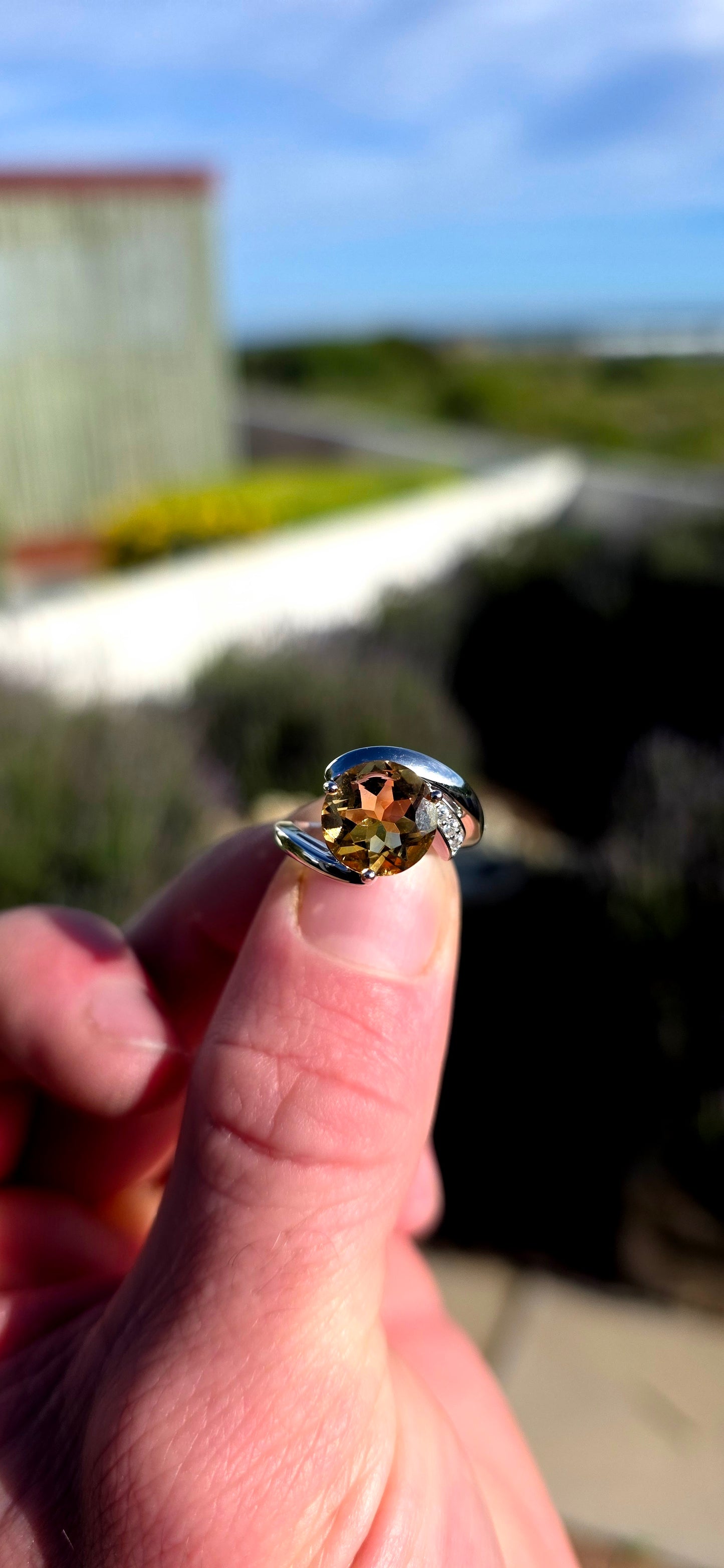 Bold, contemporary and full of golden brilliance... this sterling silver bypass ring is the perfect statement piece for lovers of vibrant gemstones and elegant modern design.
