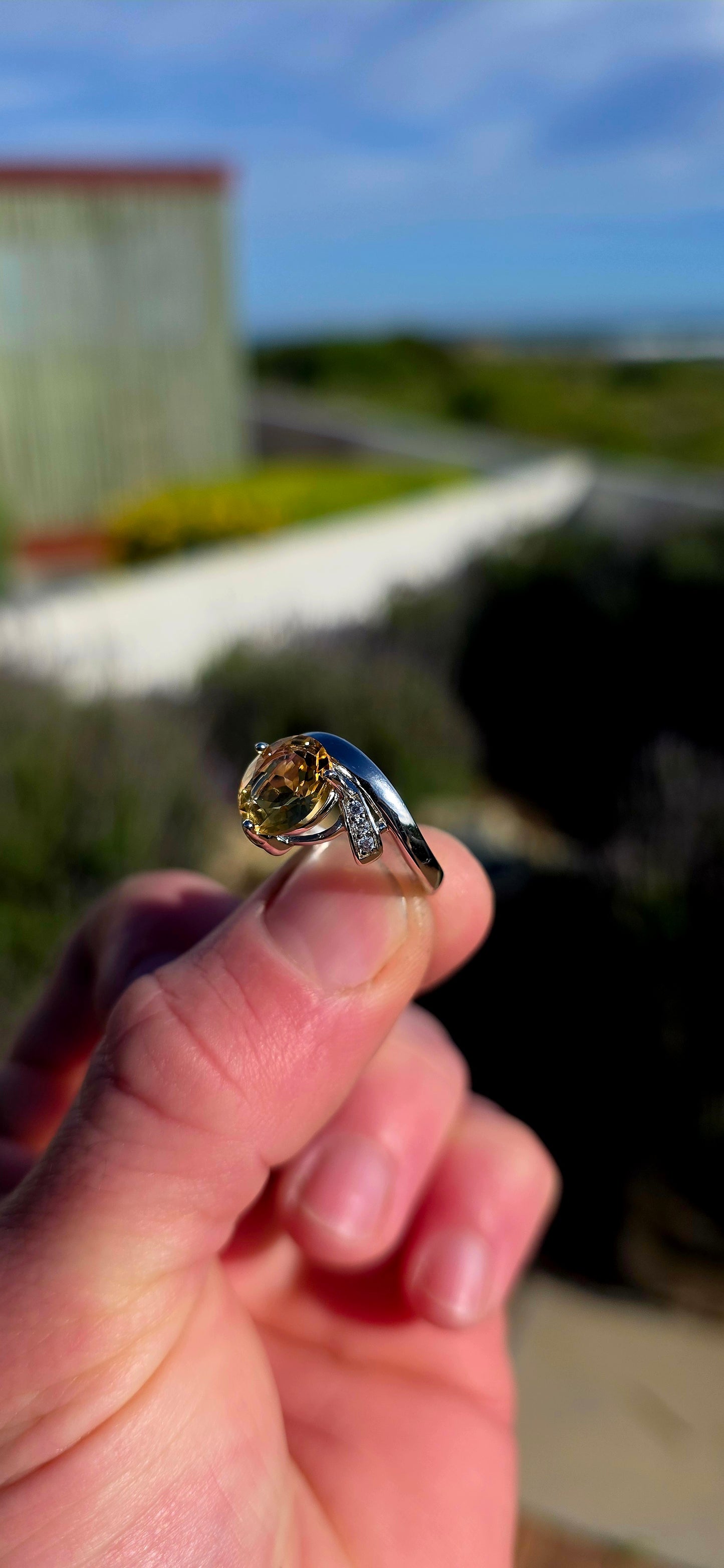 Bold, contemporary and full of golden brilliance... this sterling silver bypass ring is the perfect statement piece for lovers of vibrant gemstones and elegant modern design.