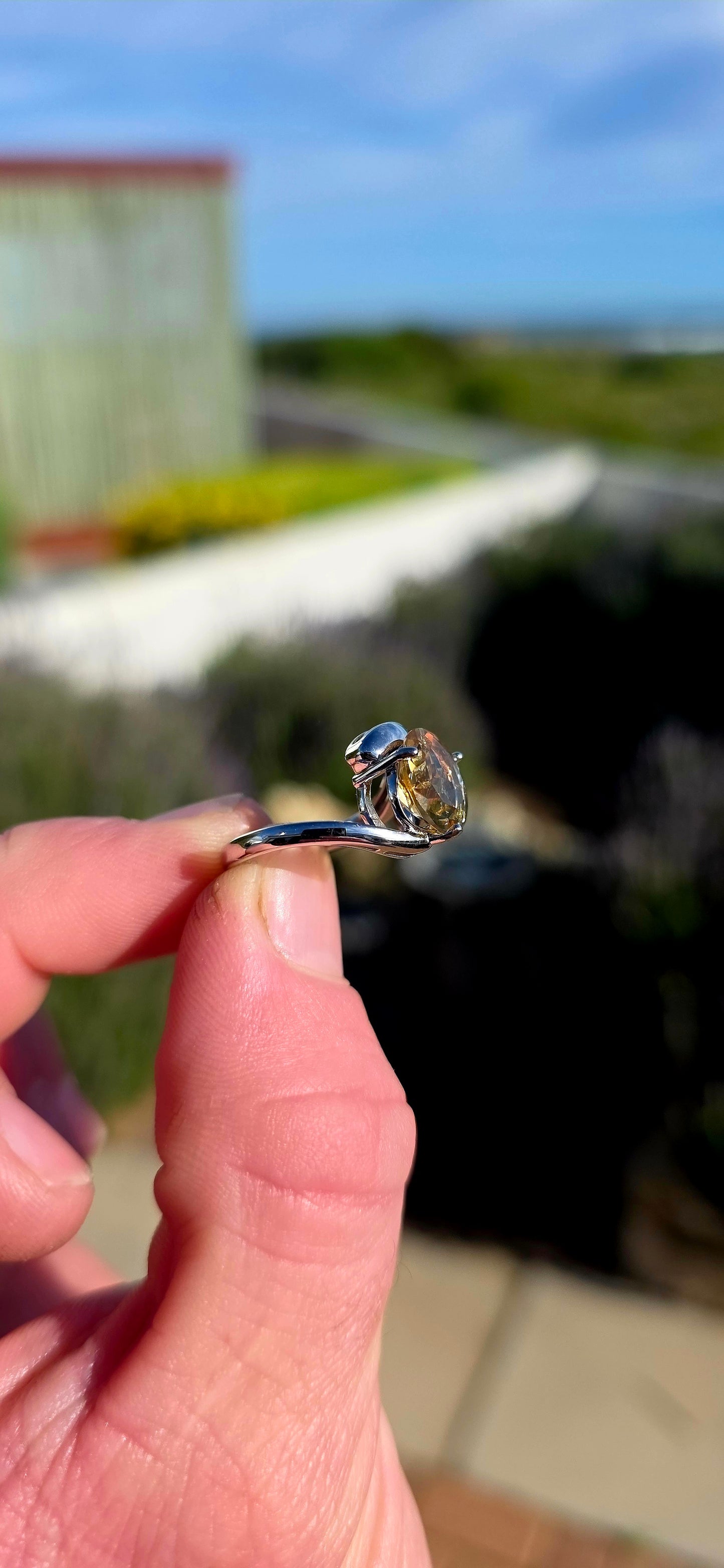 Bold, contemporary and full of golden brilliance... this sterling silver bypass ring is the perfect statement piece for lovers of vibrant gemstones and elegant modern design.