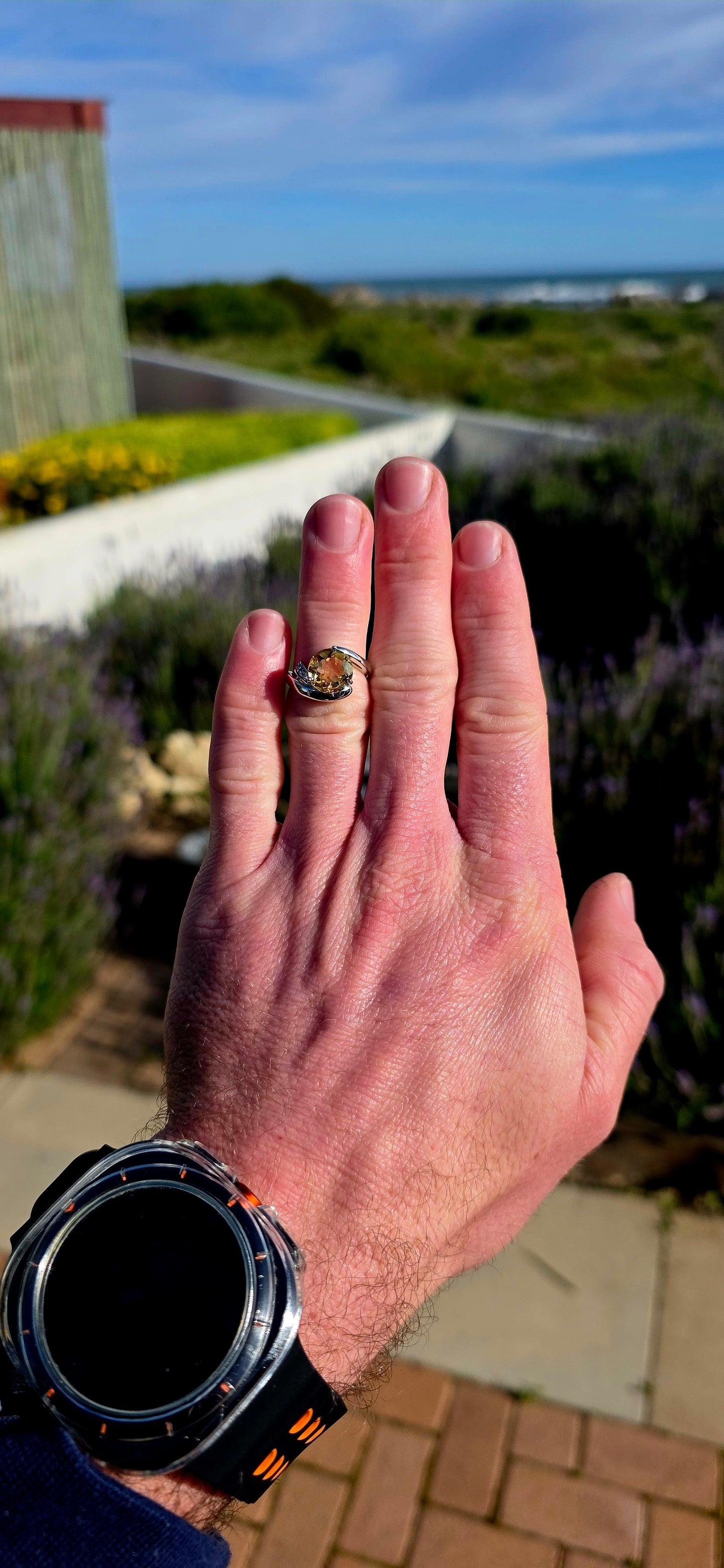 Bold, contemporary and full of golden brilliance... this sterling silver bypass ring is the perfect statement piece for lovers of vibrant gemstones and elegant modern design.