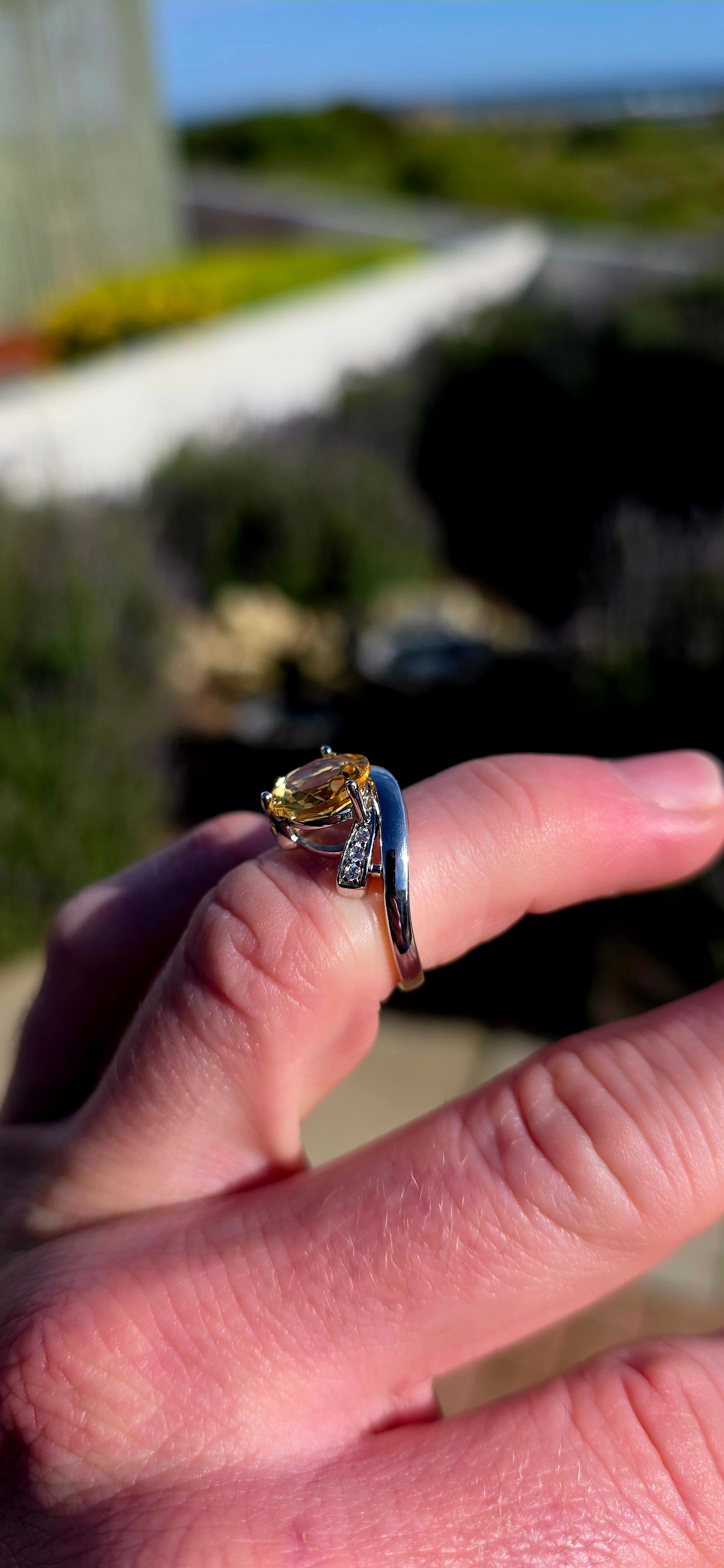 Bold, contemporary and full of golden brilliance... this sterling silver bypass ring is the perfect statement piece for lovers of vibrant gemstones and elegant modern design.