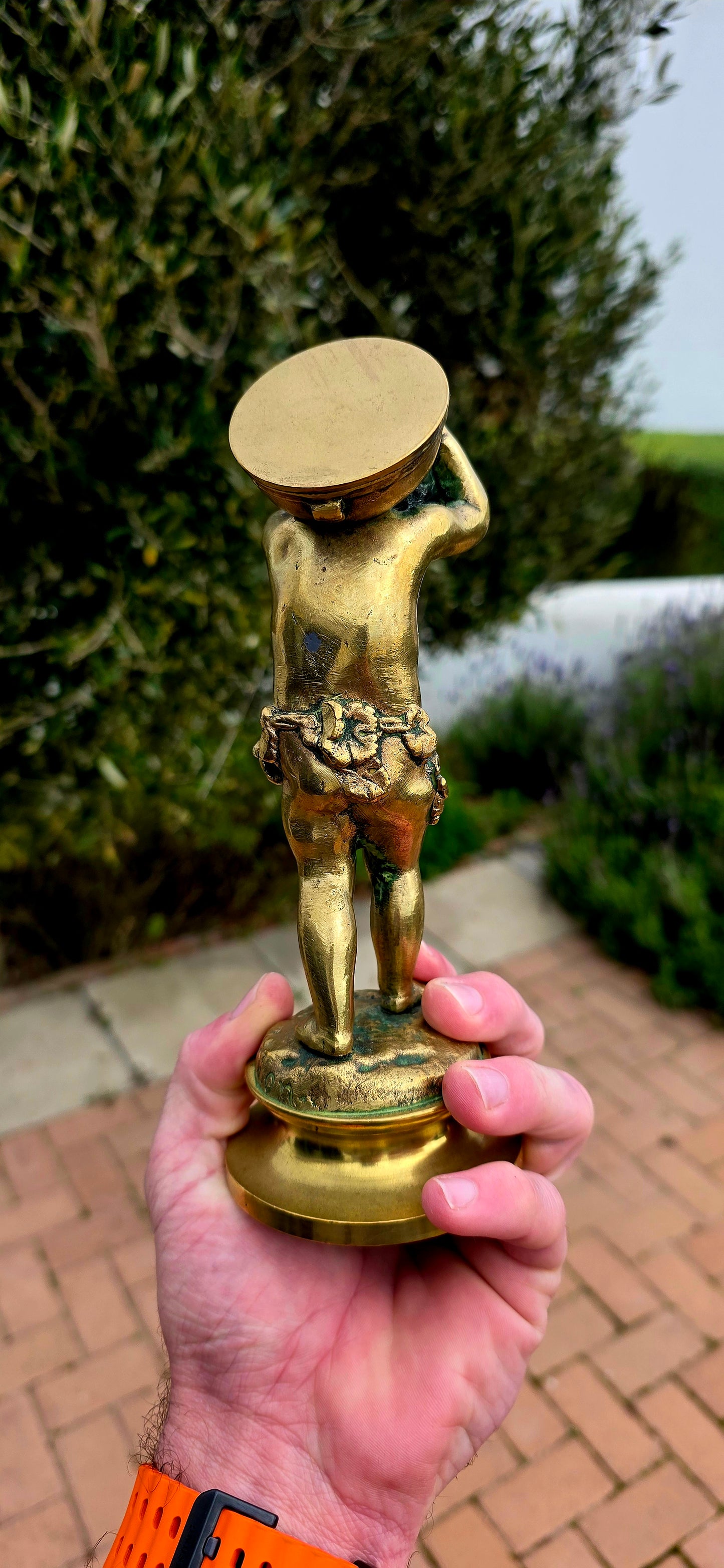 An exceptionally charming and highly collectible 19th-century Victorian bronze depicting the playful Cupid (Putto) joyfully carrying a musical drum upon his shoulders.