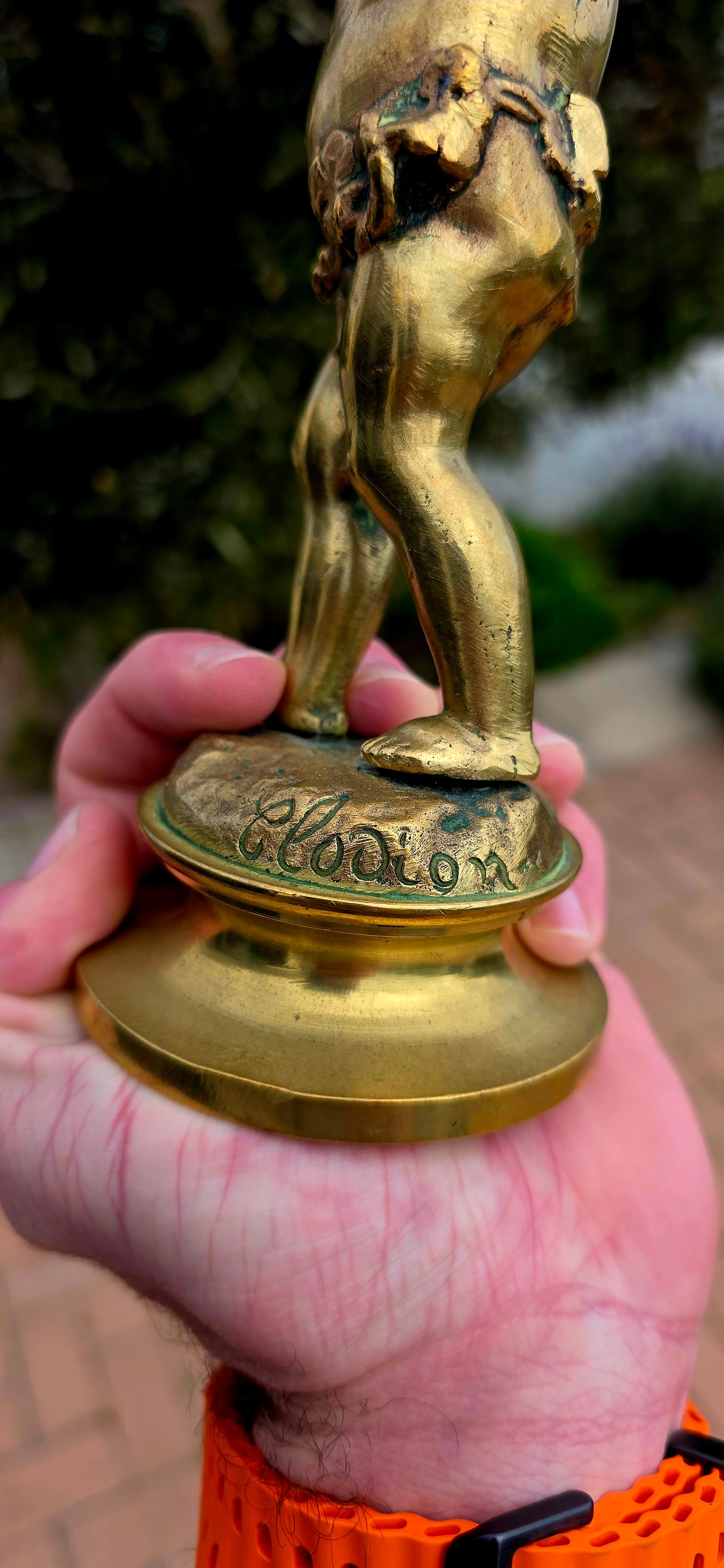 An exceptionally charming and highly collectible 19th-century Victorian bronze depicting the playful Cupid (Putto) joyfully carrying a musical drum upon his shoulders.