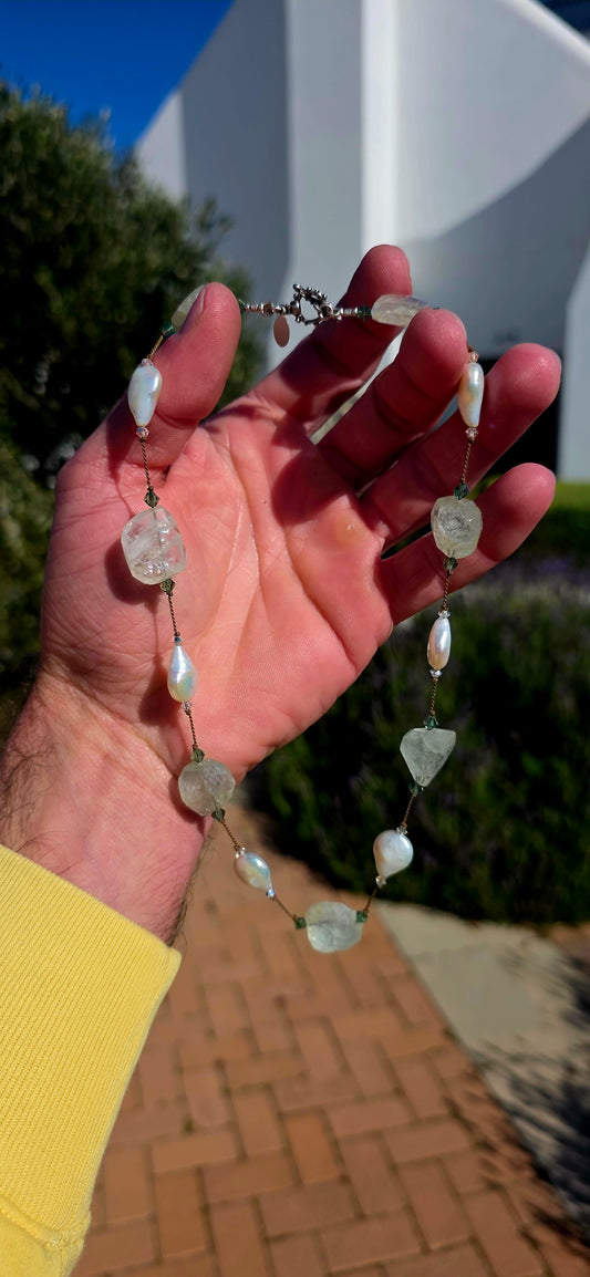 An effortlessly elegant designer necklace by renowned New York jewellery designer Margo Morrison, celebrated for her signature use of organic gemstones, luminous pearls, and delicate silk threading.
