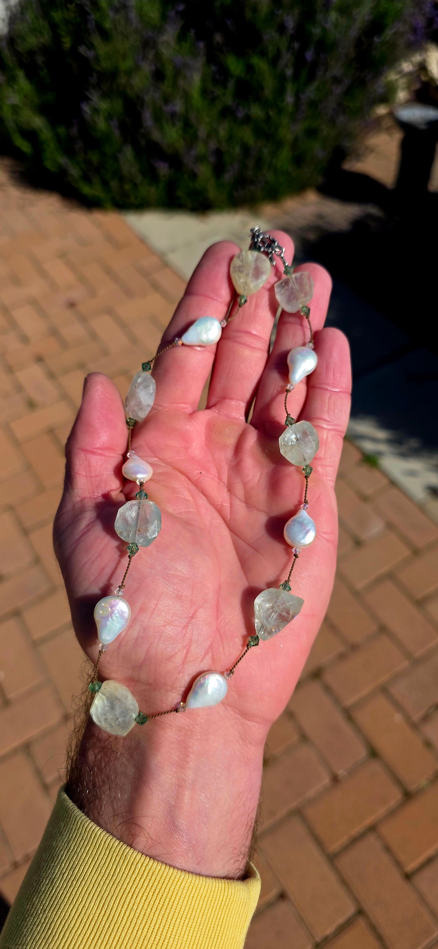 An effortlessly elegant designer necklace by renowned New York jewellery designer Margo Morrison, celebrated for her signature use of organic gemstones, luminous pearls, and delicate silk threading.