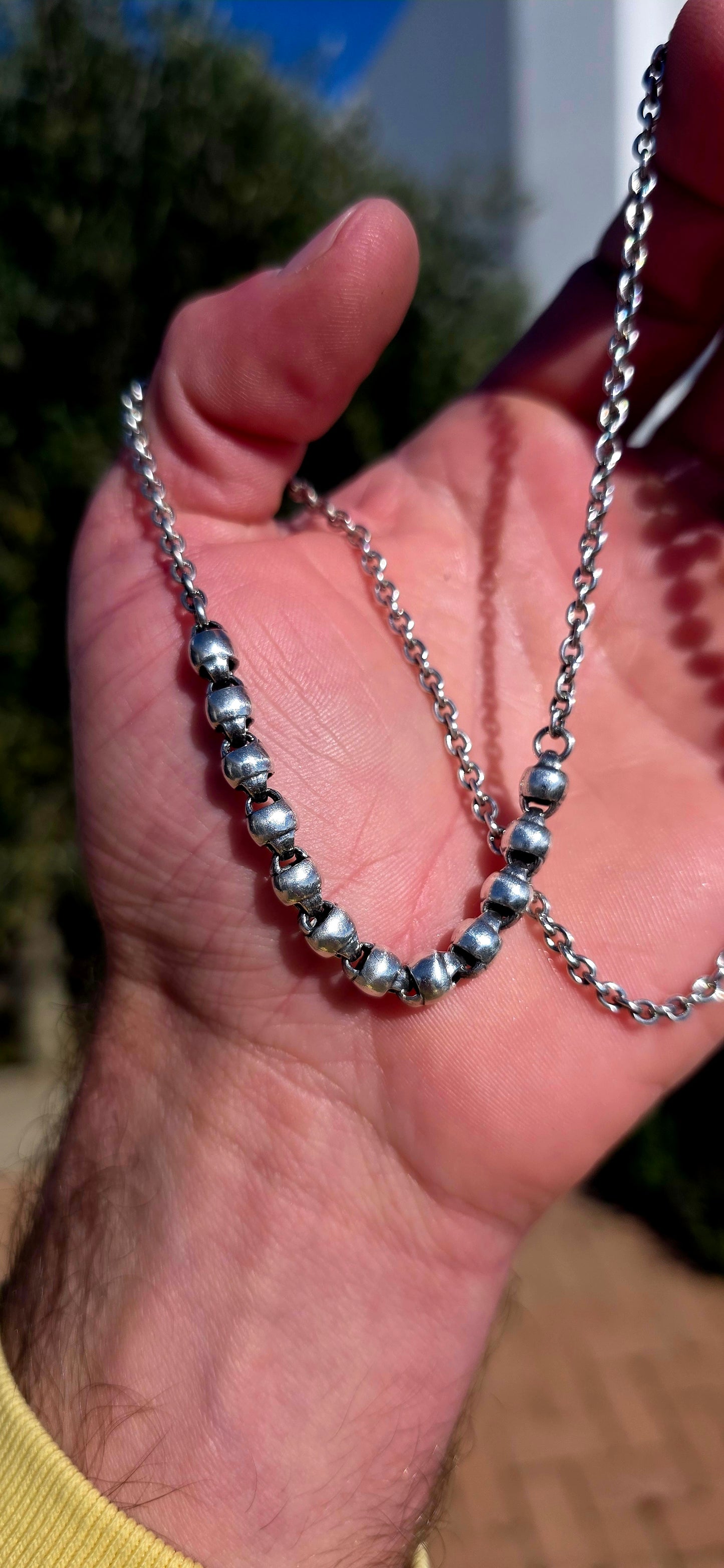Minimalist, versatile, and effortlessly cool. This handcrafted sterling silver necklace features alternating round bead sections and classic belcher links, finished with a beautifully detailed artisan toggle clasp.
