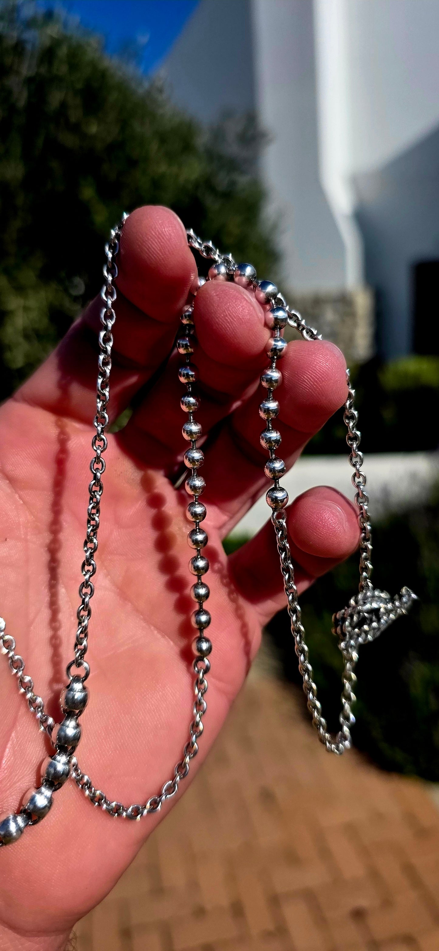 Minimalist, versatile, and effortlessly cool. This handcrafted sterling silver necklace features alternating round bead sections and classic belcher links, finished with a beautifully detailed artisan toggle clasp.