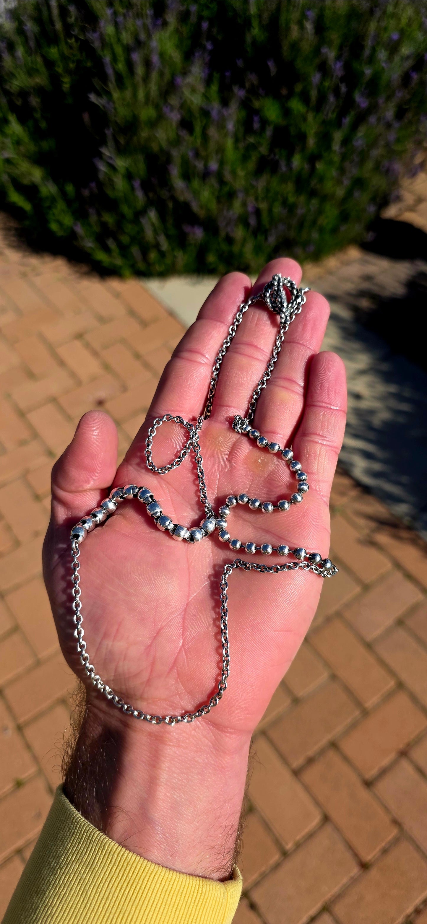 Minimalist, versatile, and effortlessly cool. This handcrafted sterling silver necklace features alternating round bead sections and classic belcher links, finished with a beautifully detailed artisan toggle clasp.