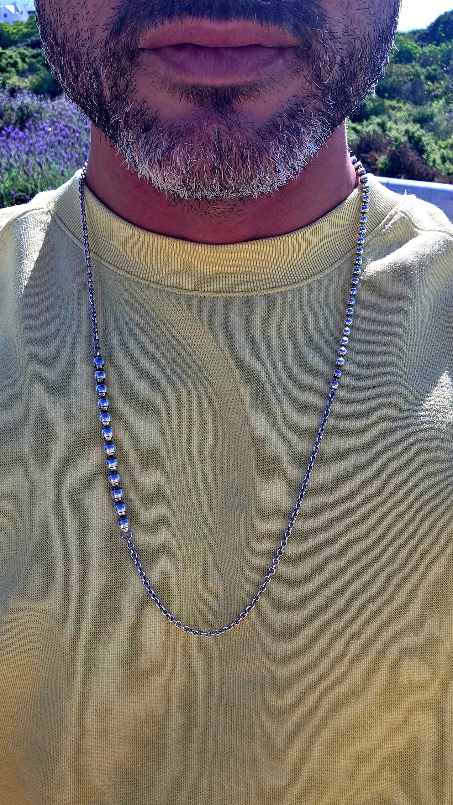 Minimalist, versatile, and effortlessly cool. This handcrafted sterling silver necklace features alternating round bead sections and classic belcher links, finished with a beautifully detailed artisan toggle clasp.