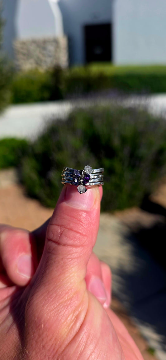 A beautifully handcrafted statement ring featuring five individual sterling silver bands, each finished with its own unique texture and character.