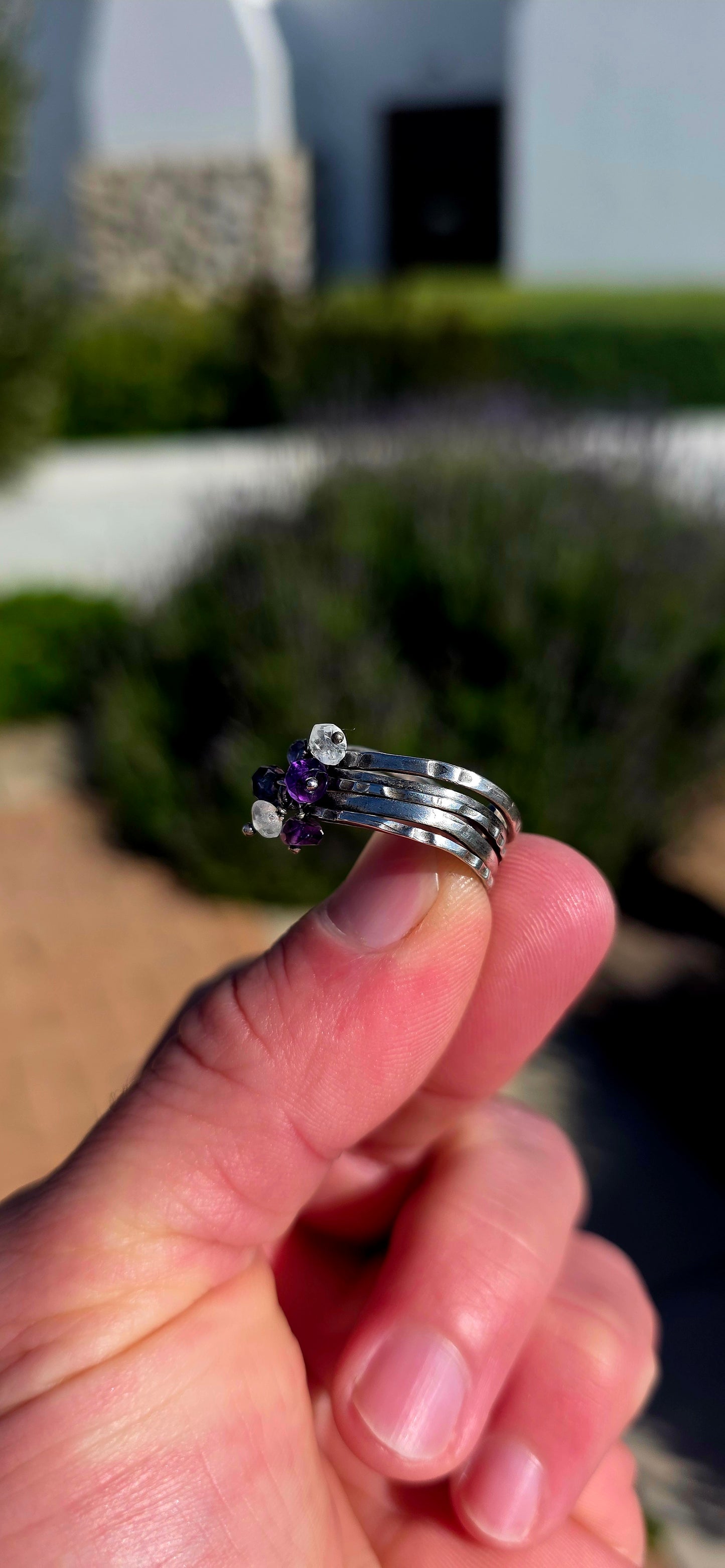 A beautifully handcrafted statement ring featuring five individual sterling silver bands, each finished with its own unique texture and character.