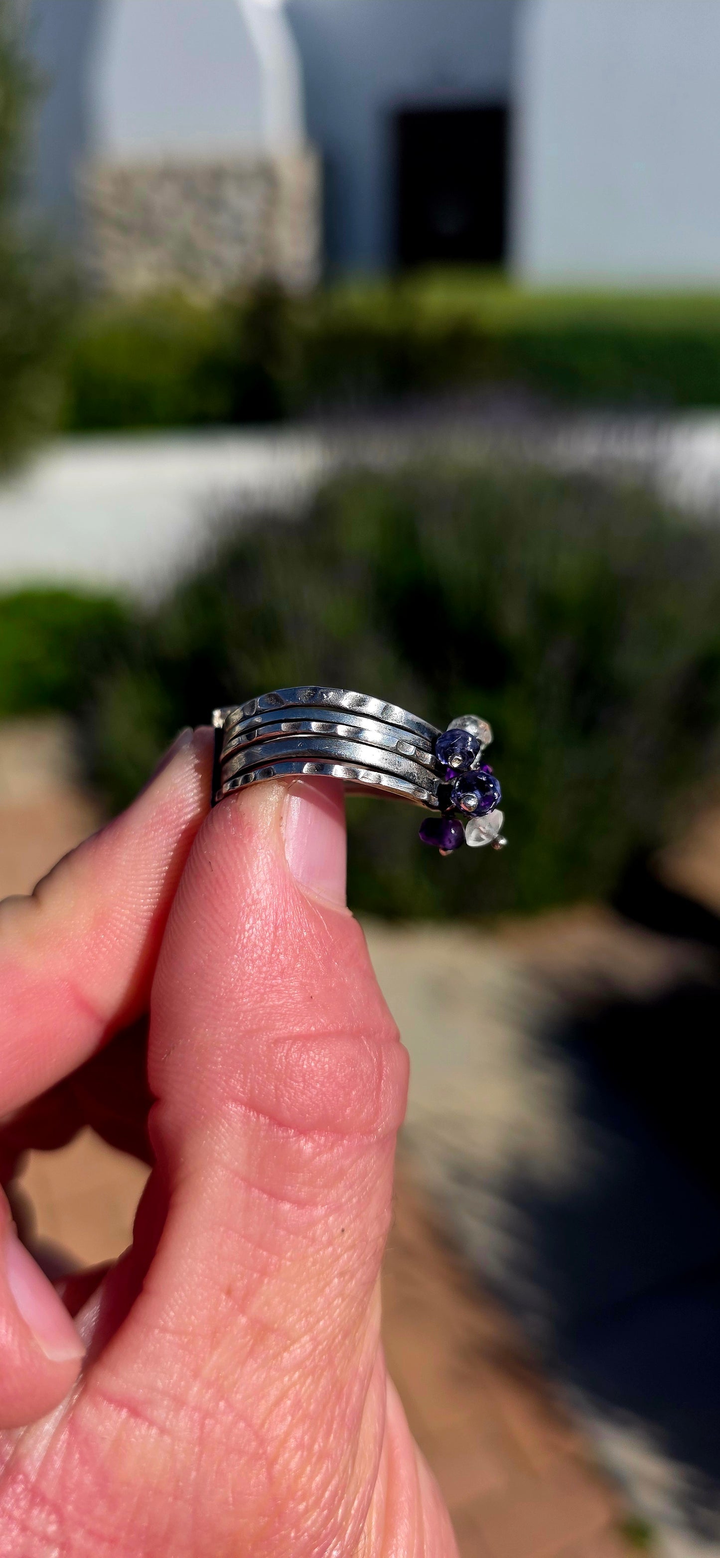 A beautifully handcrafted statement ring featuring five individual sterling silver bands, each finished with its own unique texture and character.
