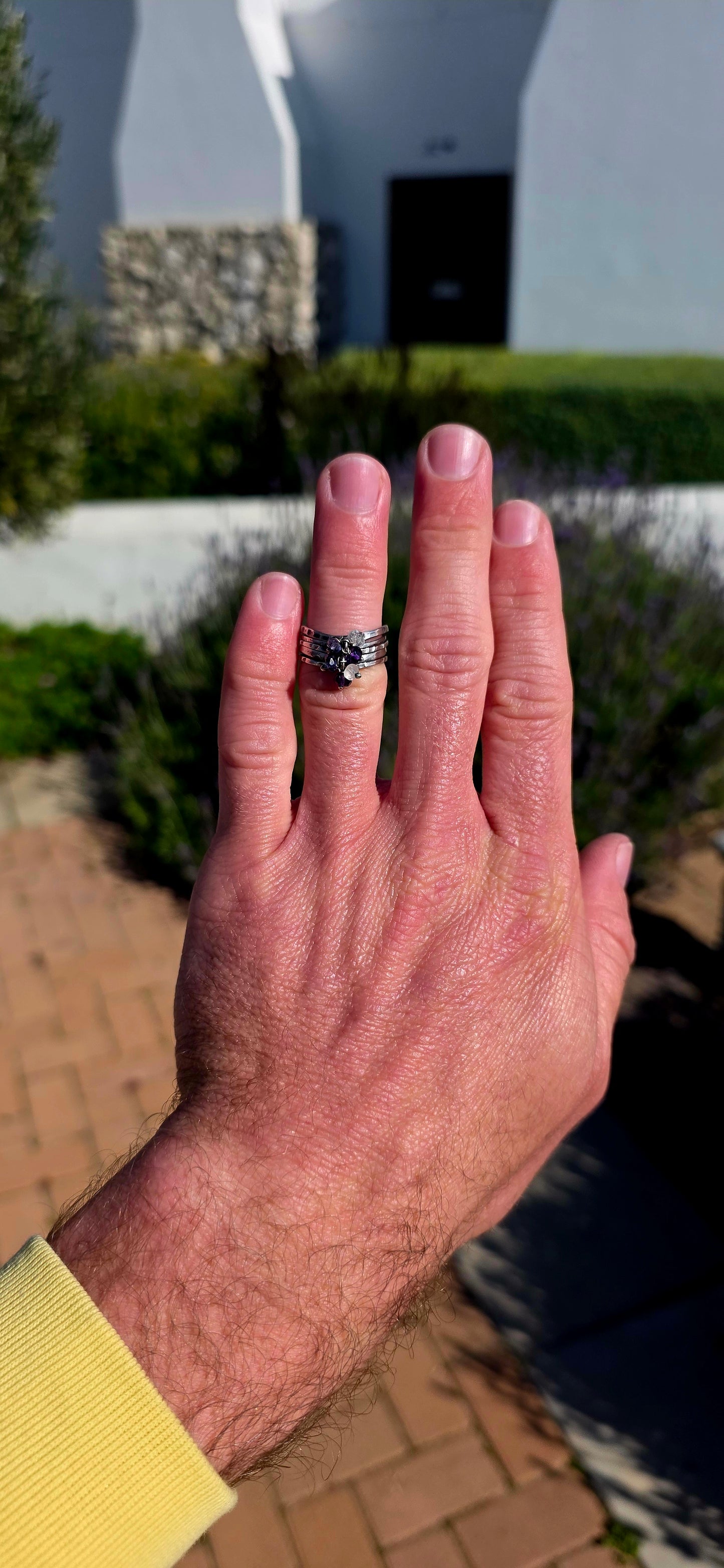 A beautifully handcrafted statement ring featuring five individual sterling silver bands, each finished with its own unique texture and character.