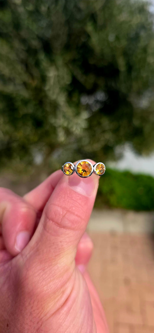 Warm, radiant and elegant... this beautiful sterling silver trilogy ring captures the golden glow of sunshine in a classical, wearable design.