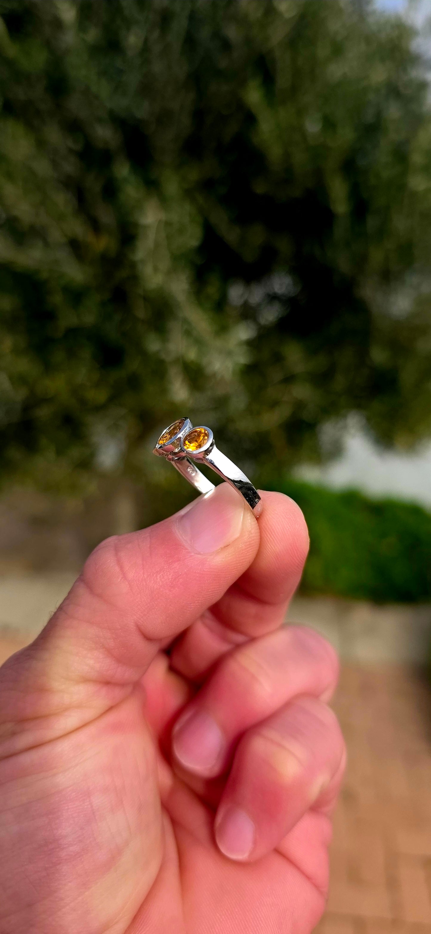 Warm, radiant and elegant... this beautiful sterling silver trilogy ring captures the golden glow of sunshine in a classical, wearable design.