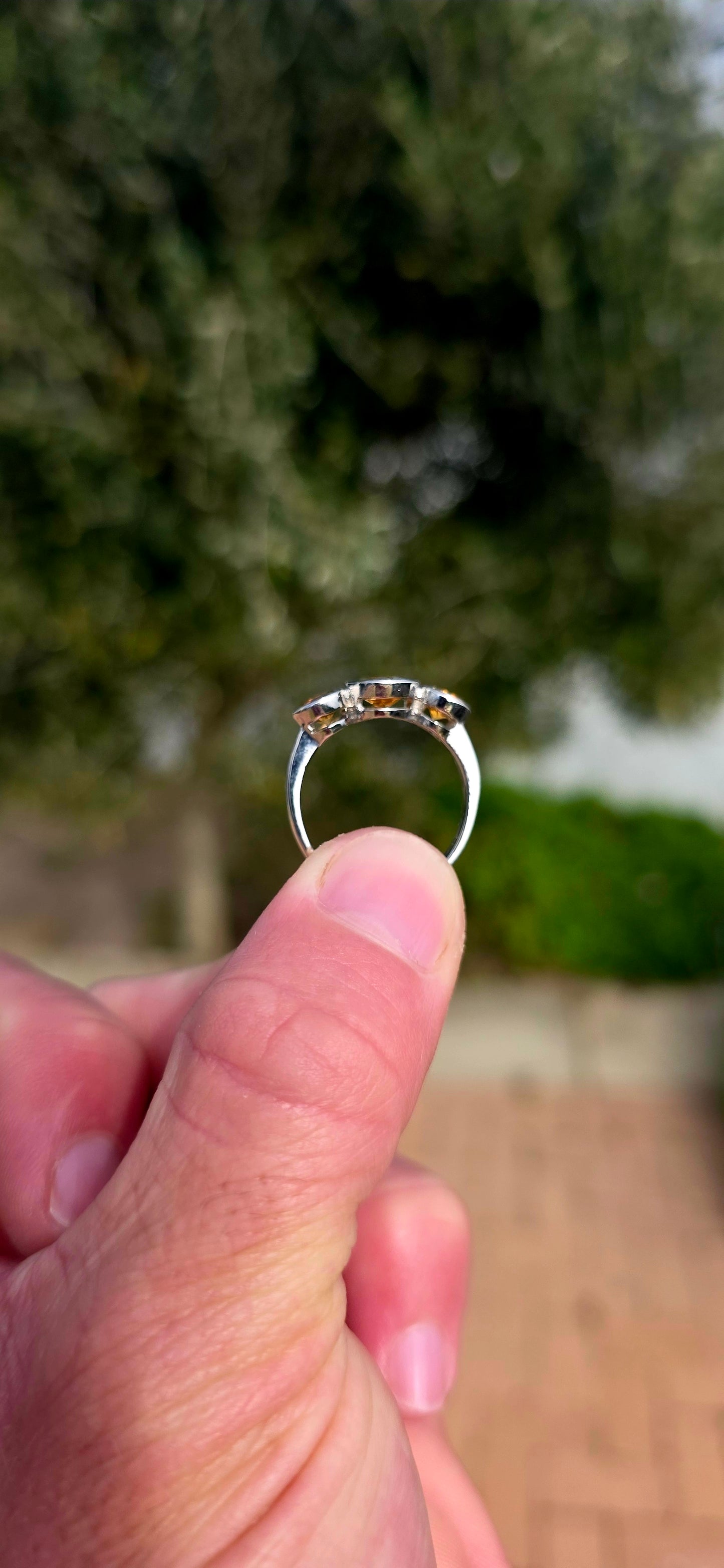 Warm, radiant and elegant... this beautiful sterling silver trilogy ring captures the golden glow of sunshine in a classical, wearable design.