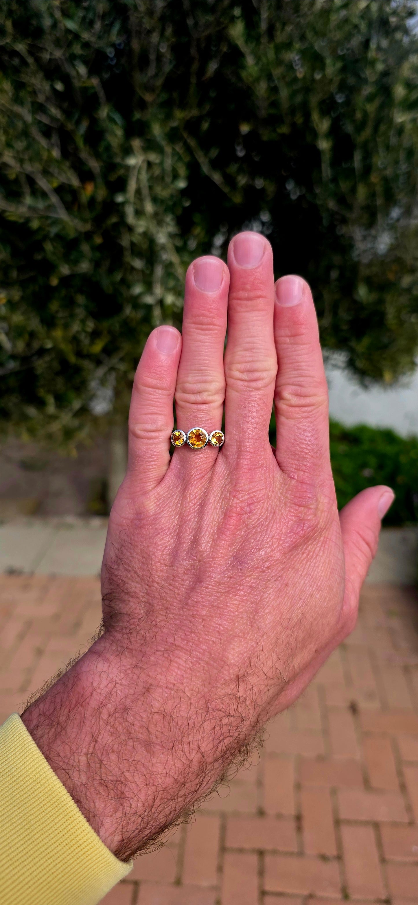 Warm, radiant and elegant... this beautiful sterling silver trilogy ring captures the golden glow of sunshine in a classical, wearable design.