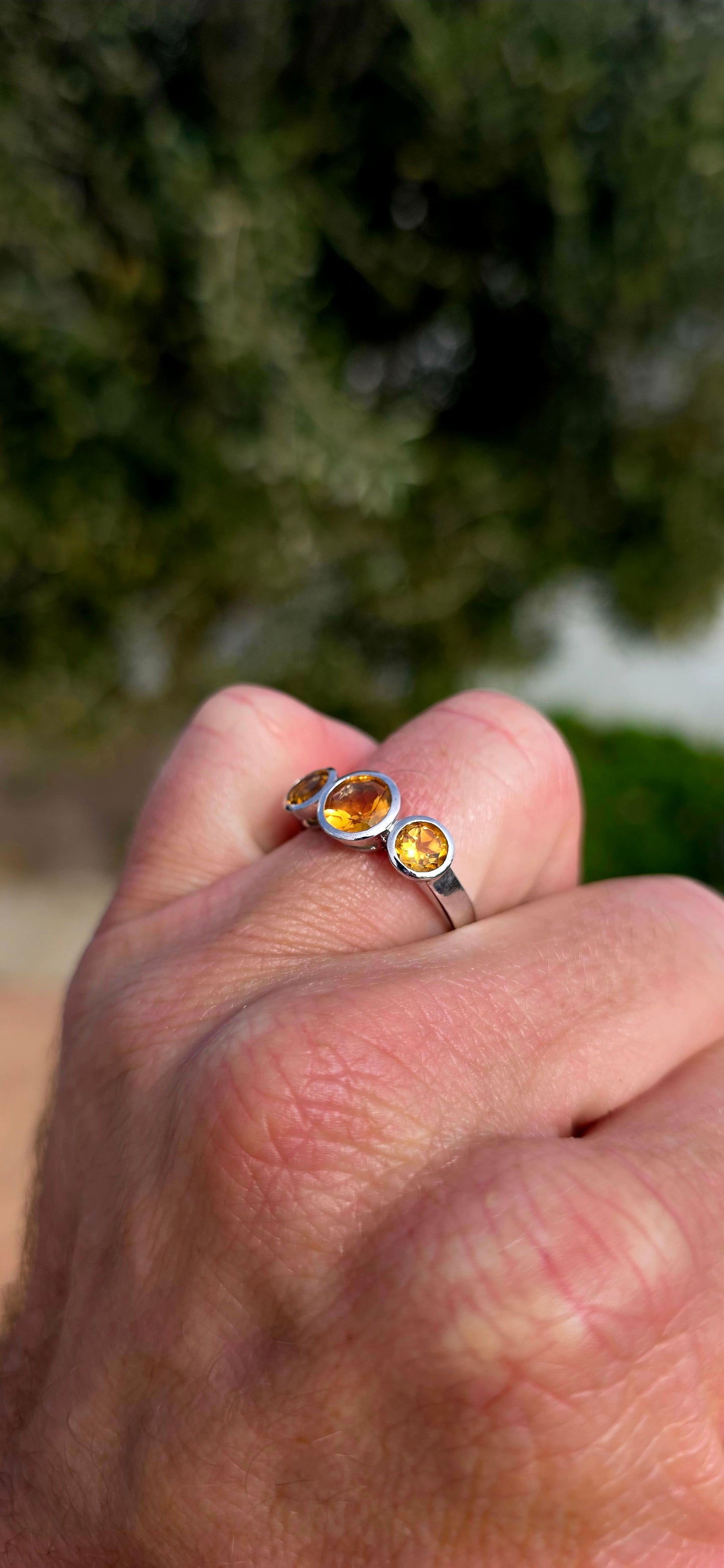 Warm, radiant and elegant... this beautiful sterling silver trilogy ring captures the golden glow of sunshine in a classical, wearable design.