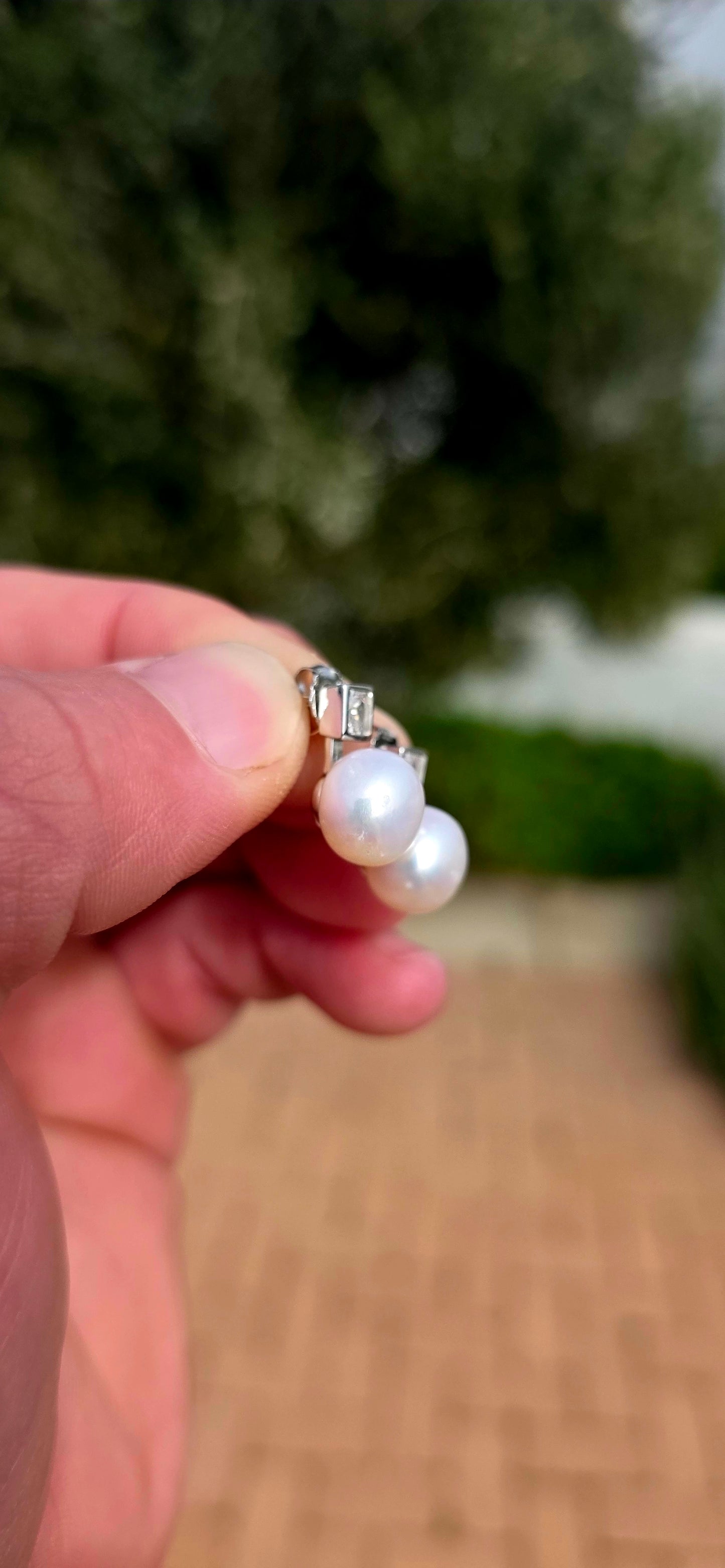 Classic, elegant and forever in style... these beautiful sterling silver stud earrings combine the beauty of pearls with the captivating sparkle of brilliant cubic zirconia.